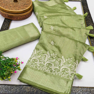 Green Art Silk Saree Adorned With Delicate Floral Embroidery & Stylish Tassel Pallu