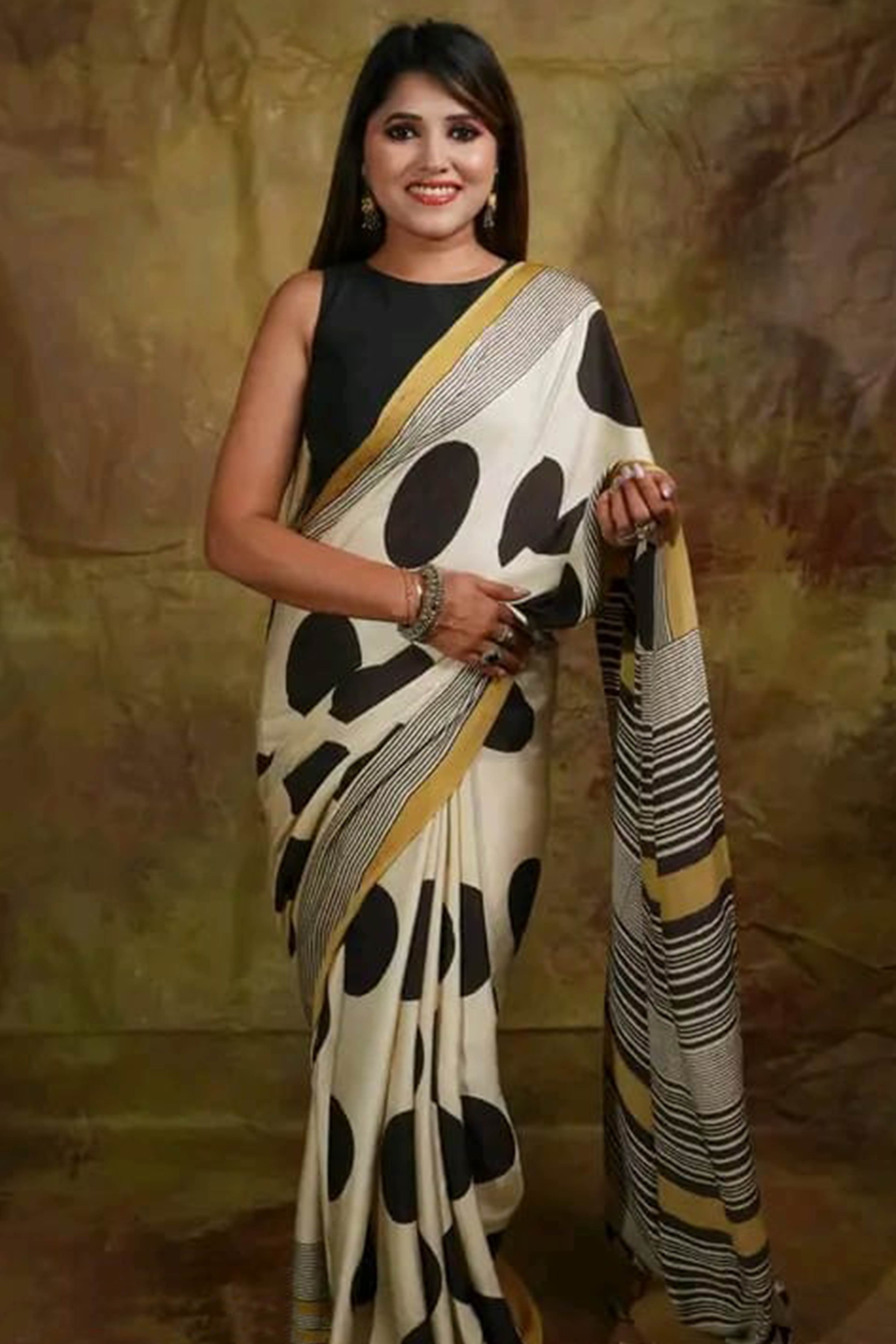 Graceful Offwhite Satin Saree Featuring Geometric & Striped Print With Tassel Pallu