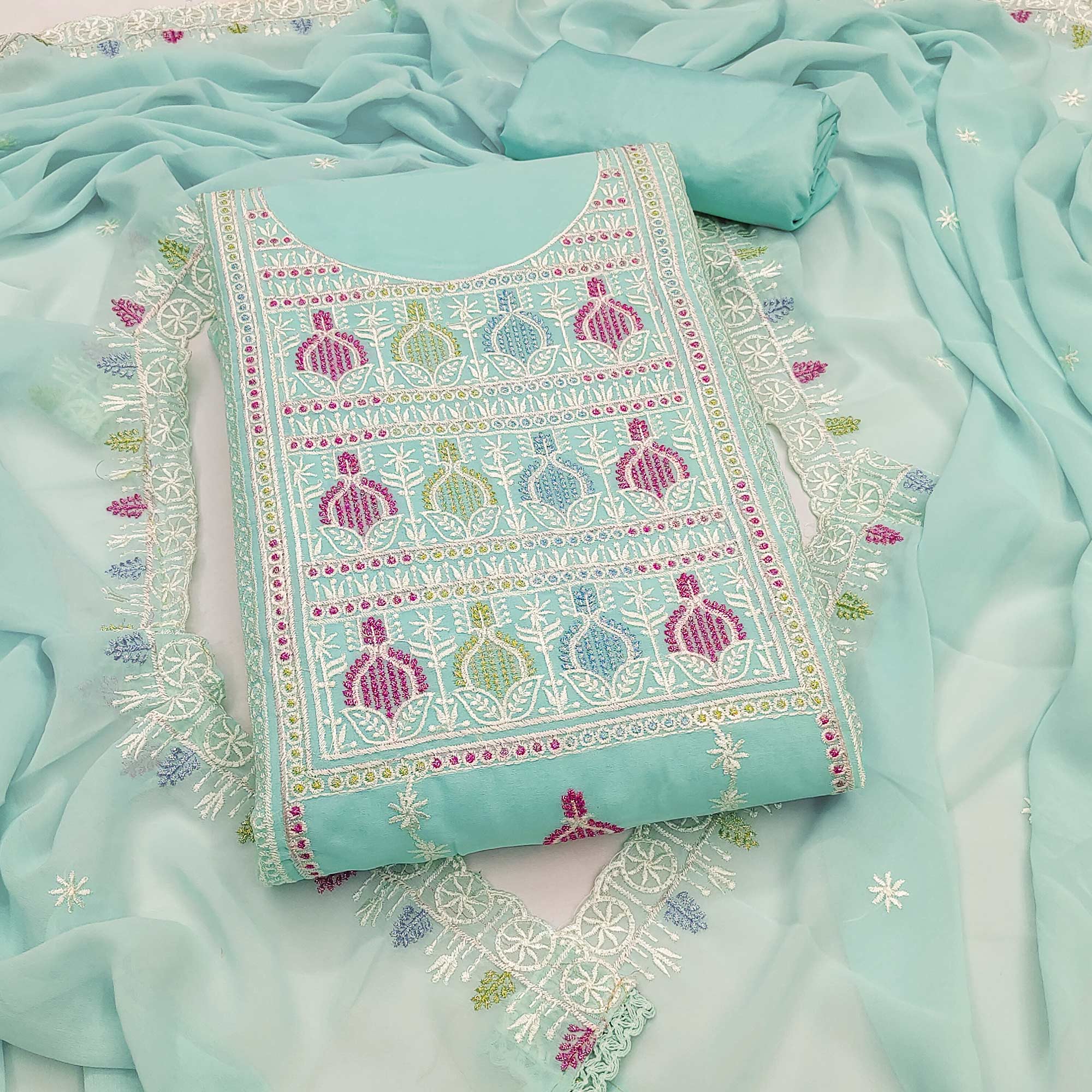 Sophisticated Turquoise Georgette Dress Material Accented With Ornate Floral Thread Embroidery