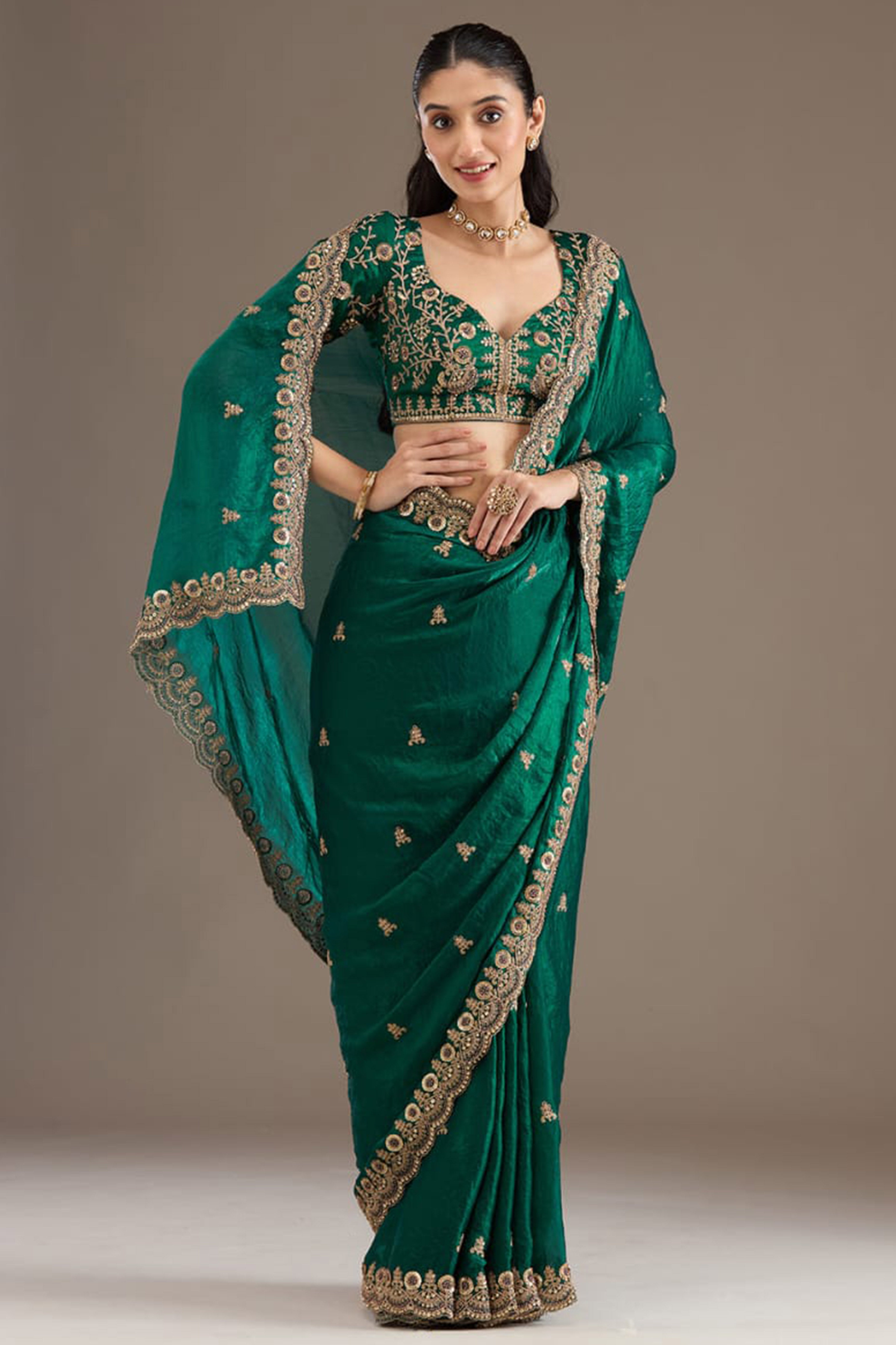 Trendy Green Fancy Satin Saree Enhanced With Rich Golden Embroidered Design