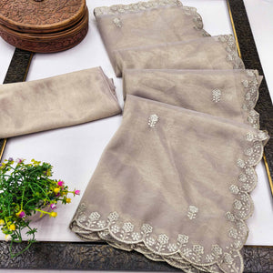 Beige Net Partywear Saree Featuring Fine Floral Embroidery and a Soft, Flowing Look