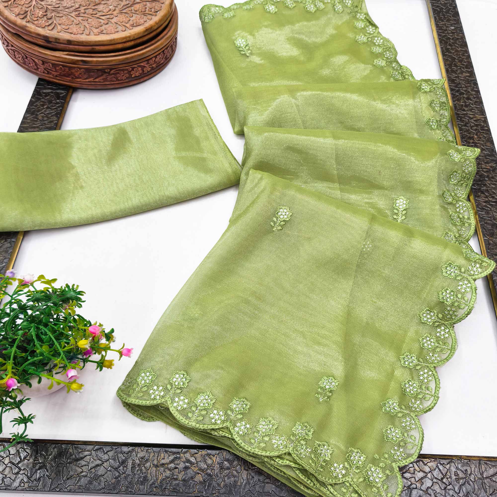 Green Net Partywear Saree Featuring Fine Floral Embroidery and a Soft, Flowing Look