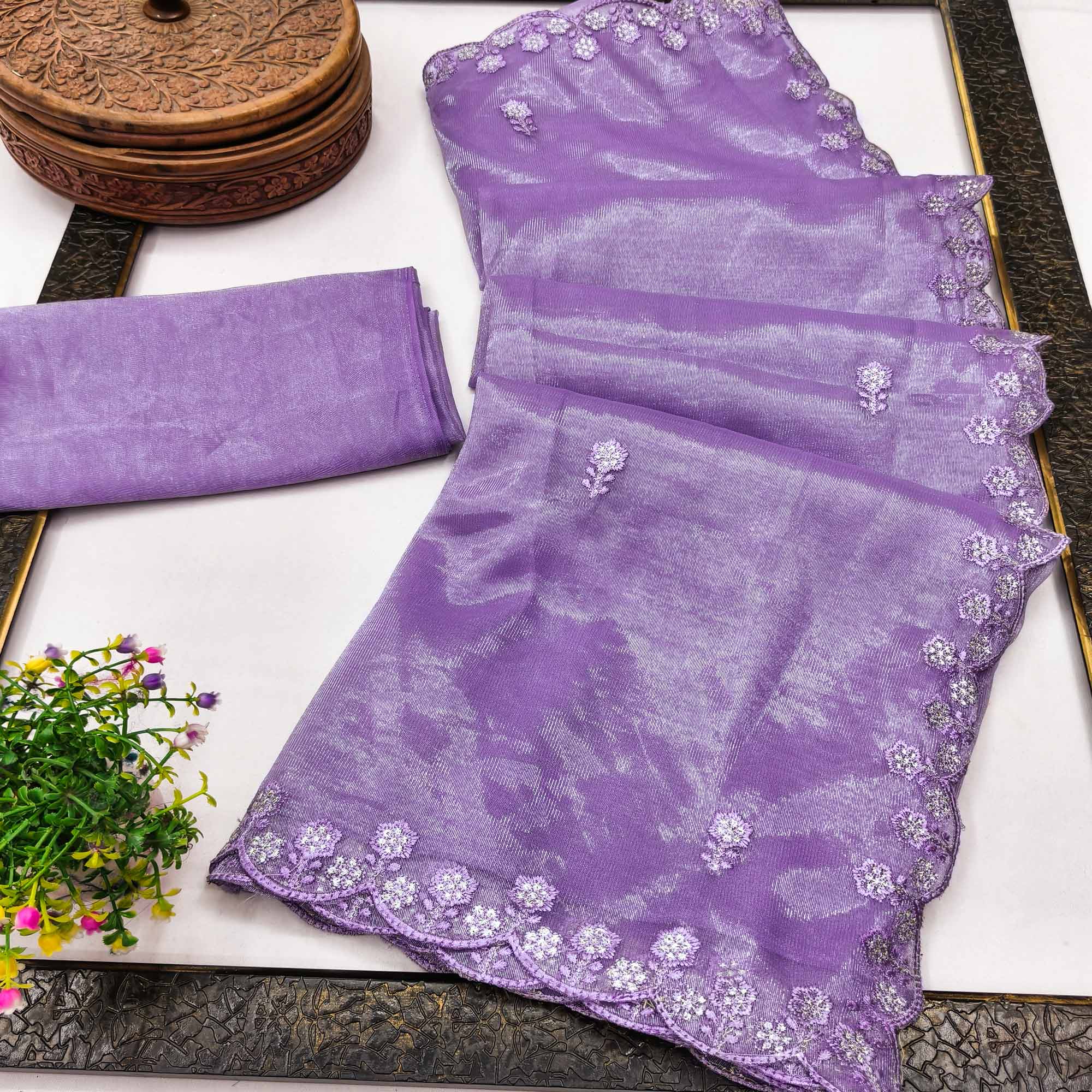 Lavender Net Partywear Saree Featuring Fine Floral Embroidery and a Soft, Flowing Look