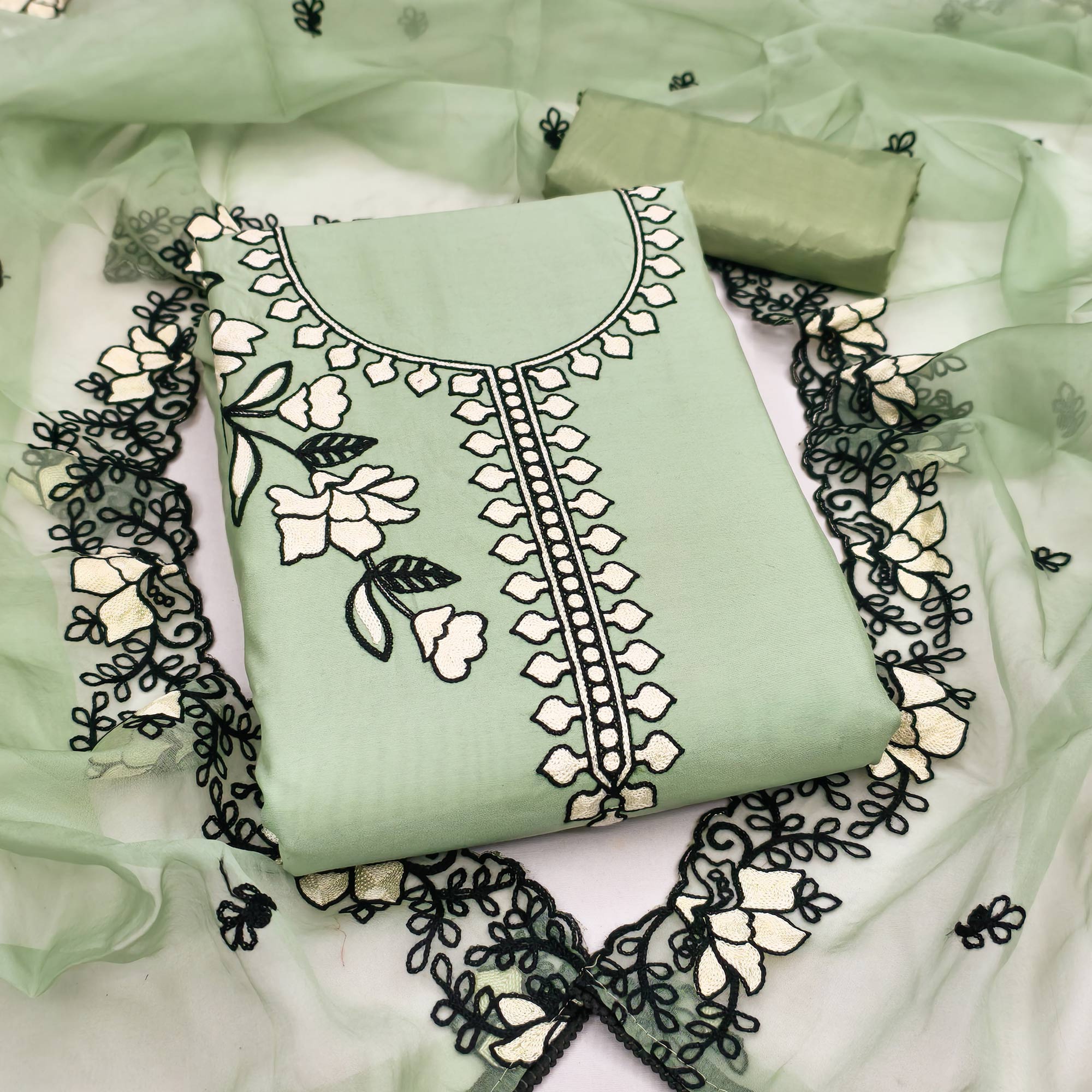 Graceful Green Floral Viscose Dress Material Enhanced With Intricate Thread Embroidery Work