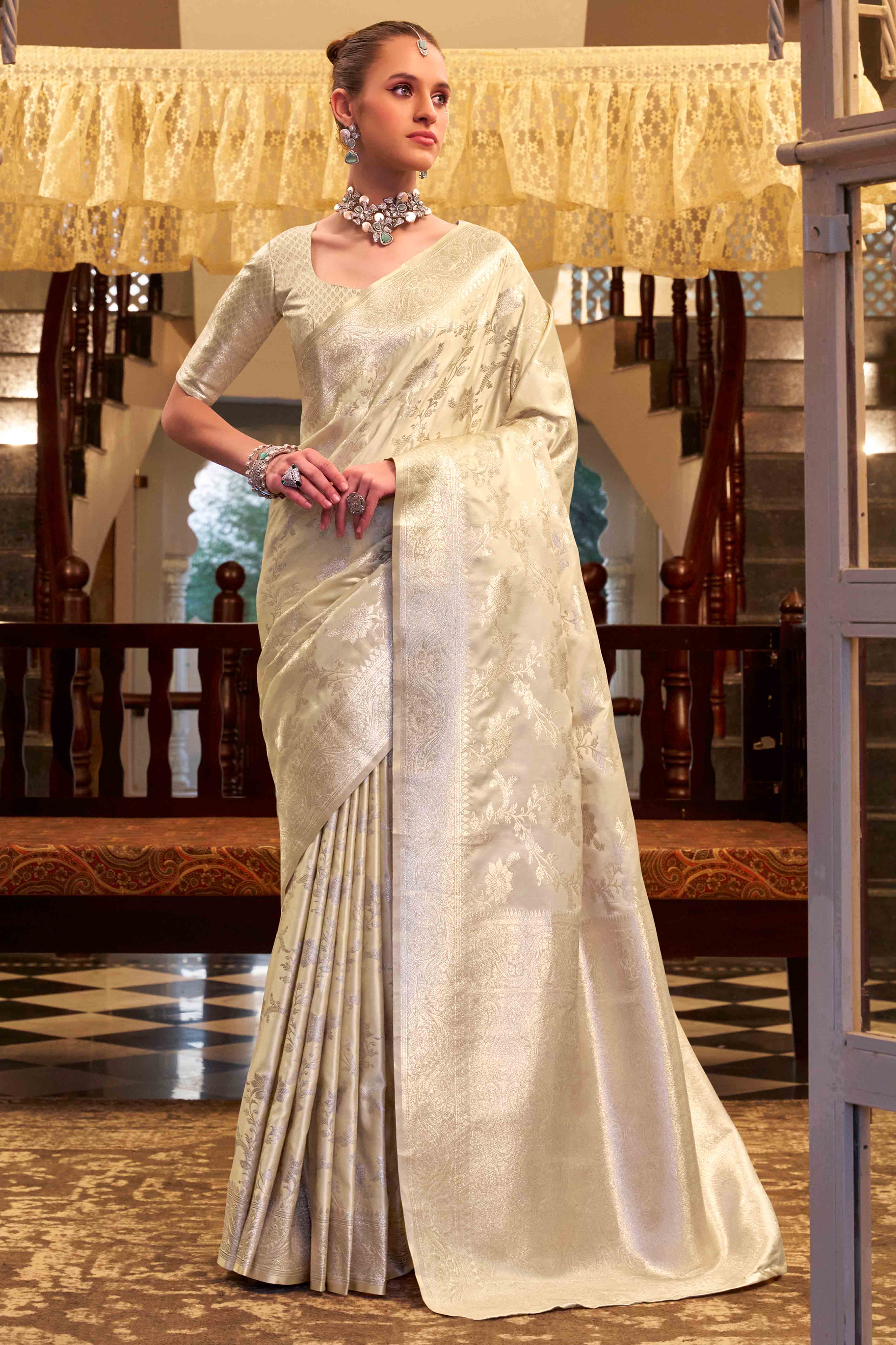 Off White Soft Satin Saree Featuring Exquisite Zari Weaving Work