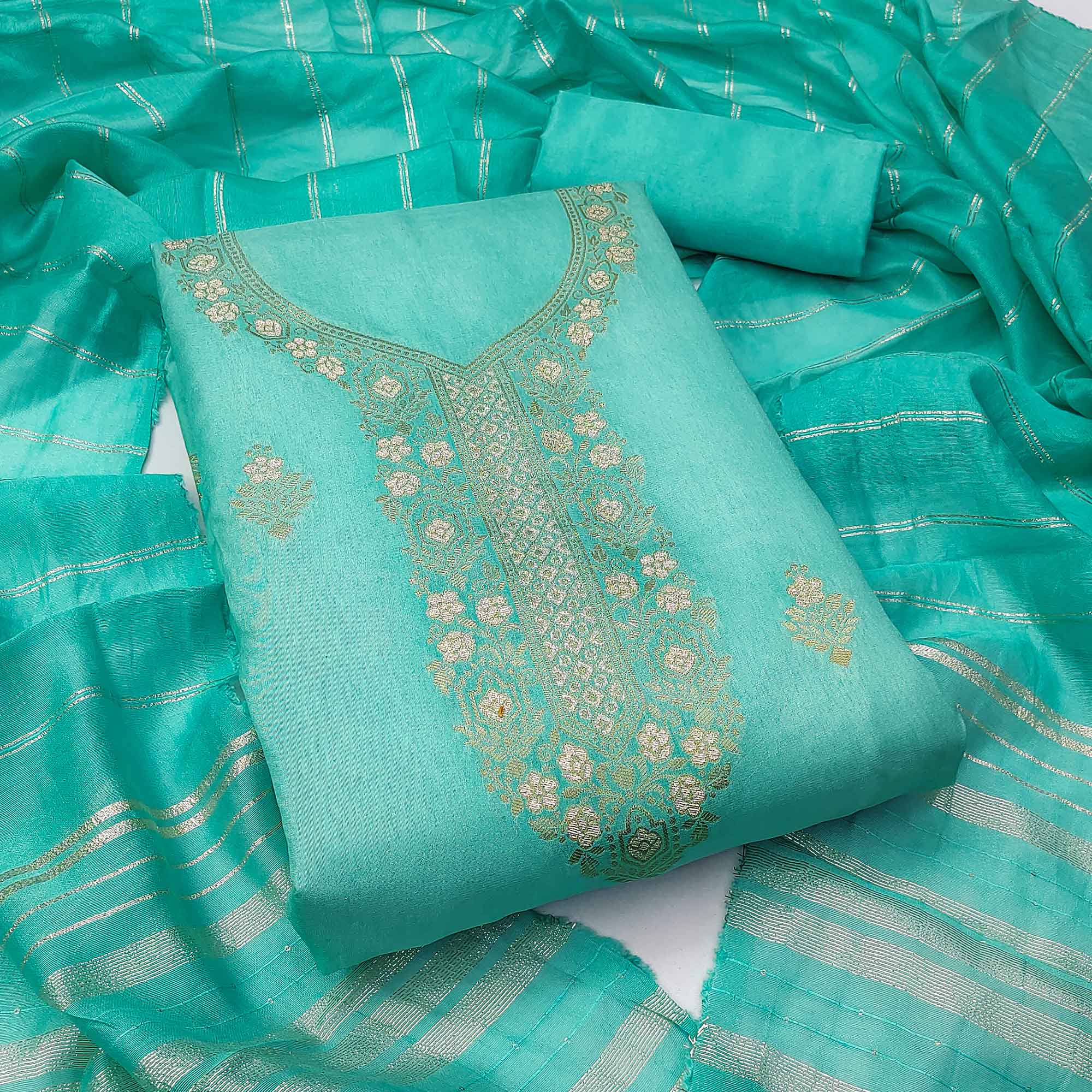 Ethereal Turquoise Banarasi Jacquard Dress Material Adorned With Ornate Zari Floral Weaves