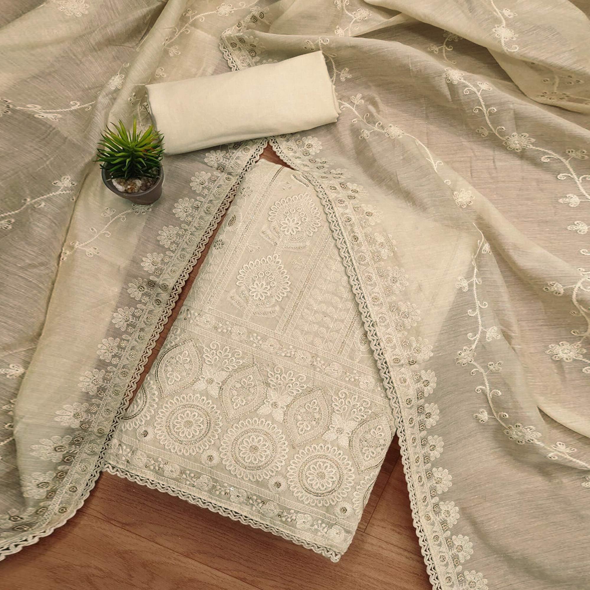 Graceful Cream Chanderi Silk Dress Material Featuring Intricate Lucknowi Embroidery