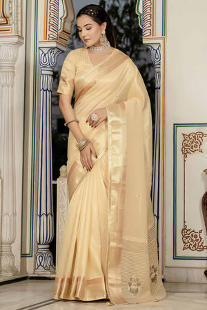 Beige Tissue Linen Saree Featuring Intricate Zari and Beadwork