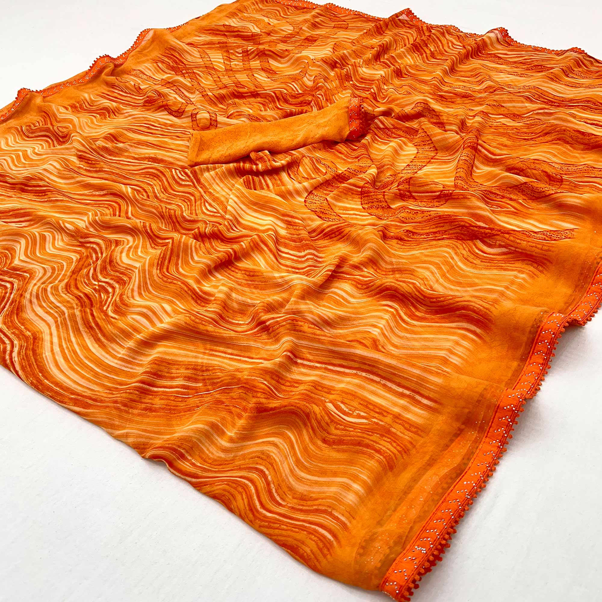 Orange Printed Georgette Saree With Fancy Lace Border