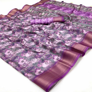 Purple Elegance In Dola Saree Featuring Blooming Digital Prints & Zari Border & Tassel Pallu