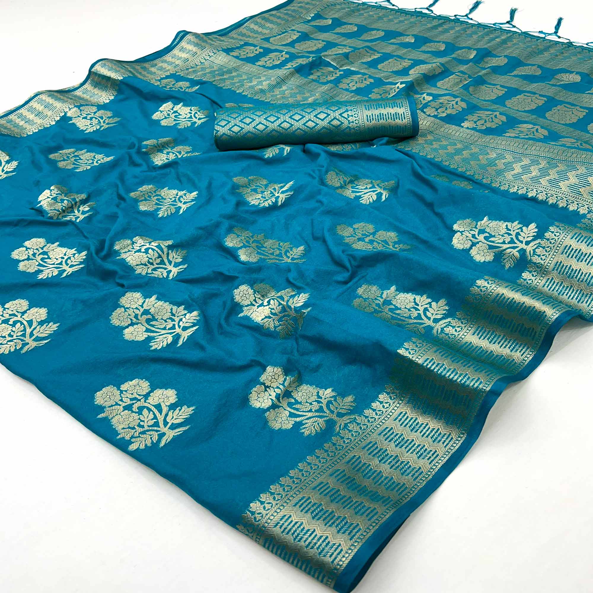 Teal Blue Crepe Silk Saree With Floral Zari Weaving & Stylish Tassel Pallu