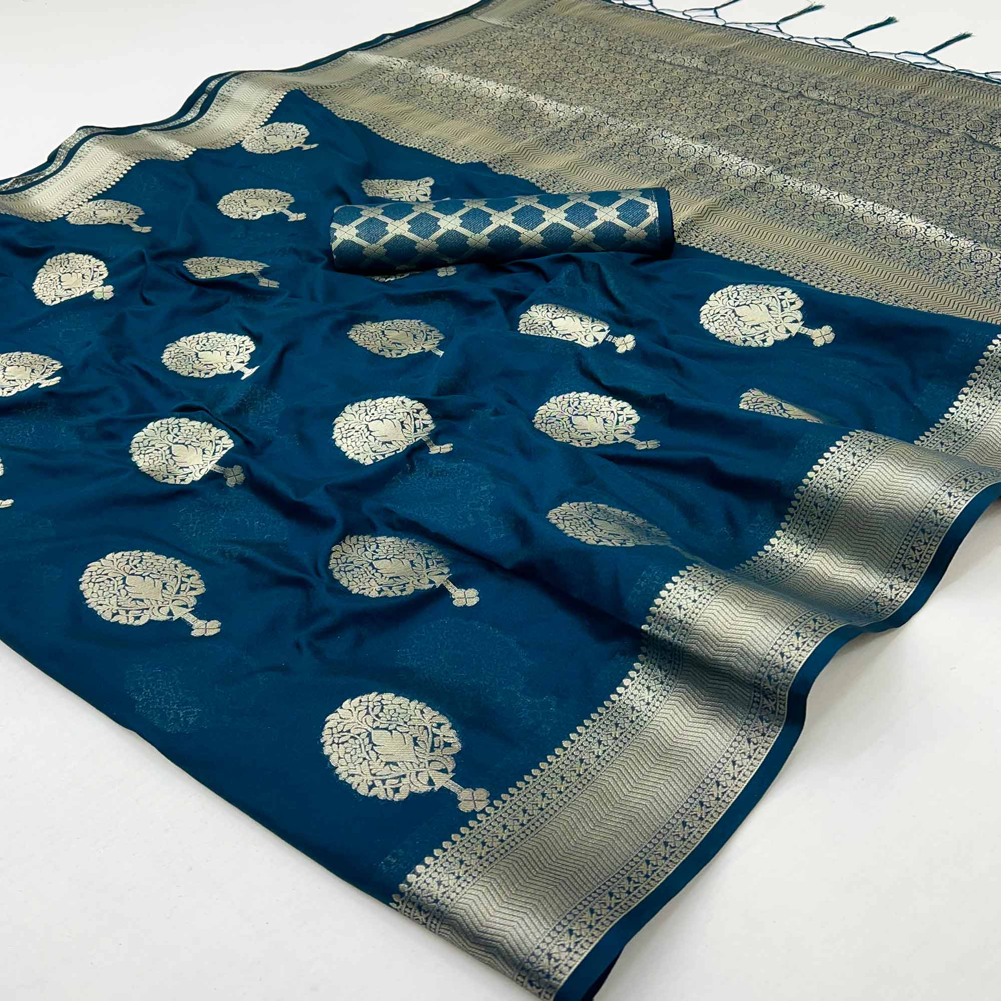 Dark Teal Blue Crepe Silk Saree Featuring Floral Zari Weave & Graceful Tassel Pallu