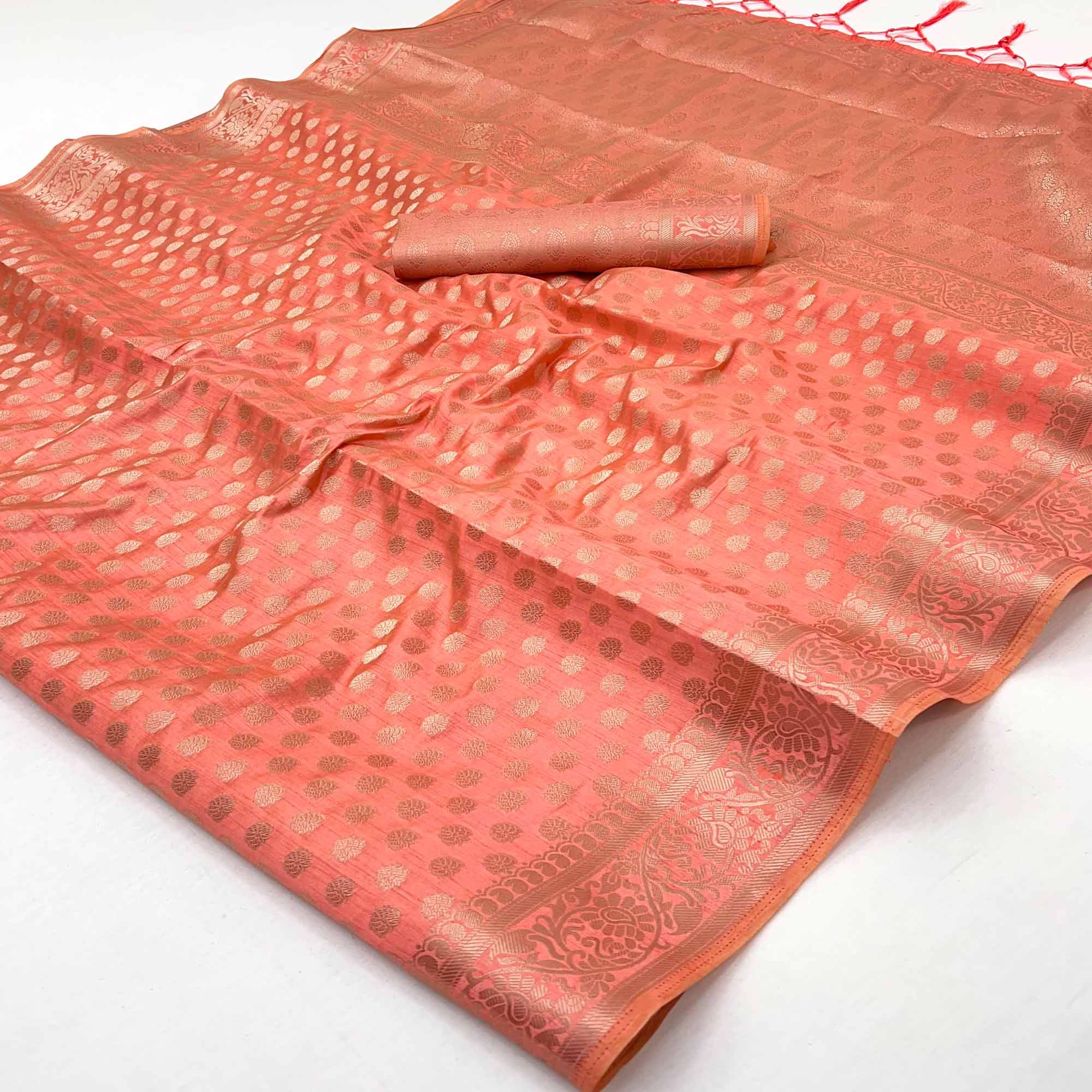 Peach Tusser Cotton Silk Saree Featuring Intricate Floral Zari Weave & Tassel Pallu
