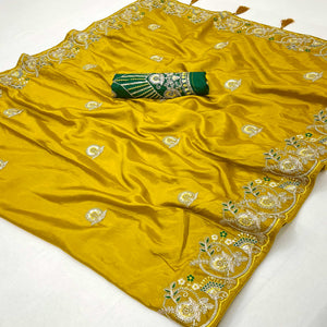 Mustard Embroidered Satin Saree with Smooth Texture and Graceful Festive Appeal