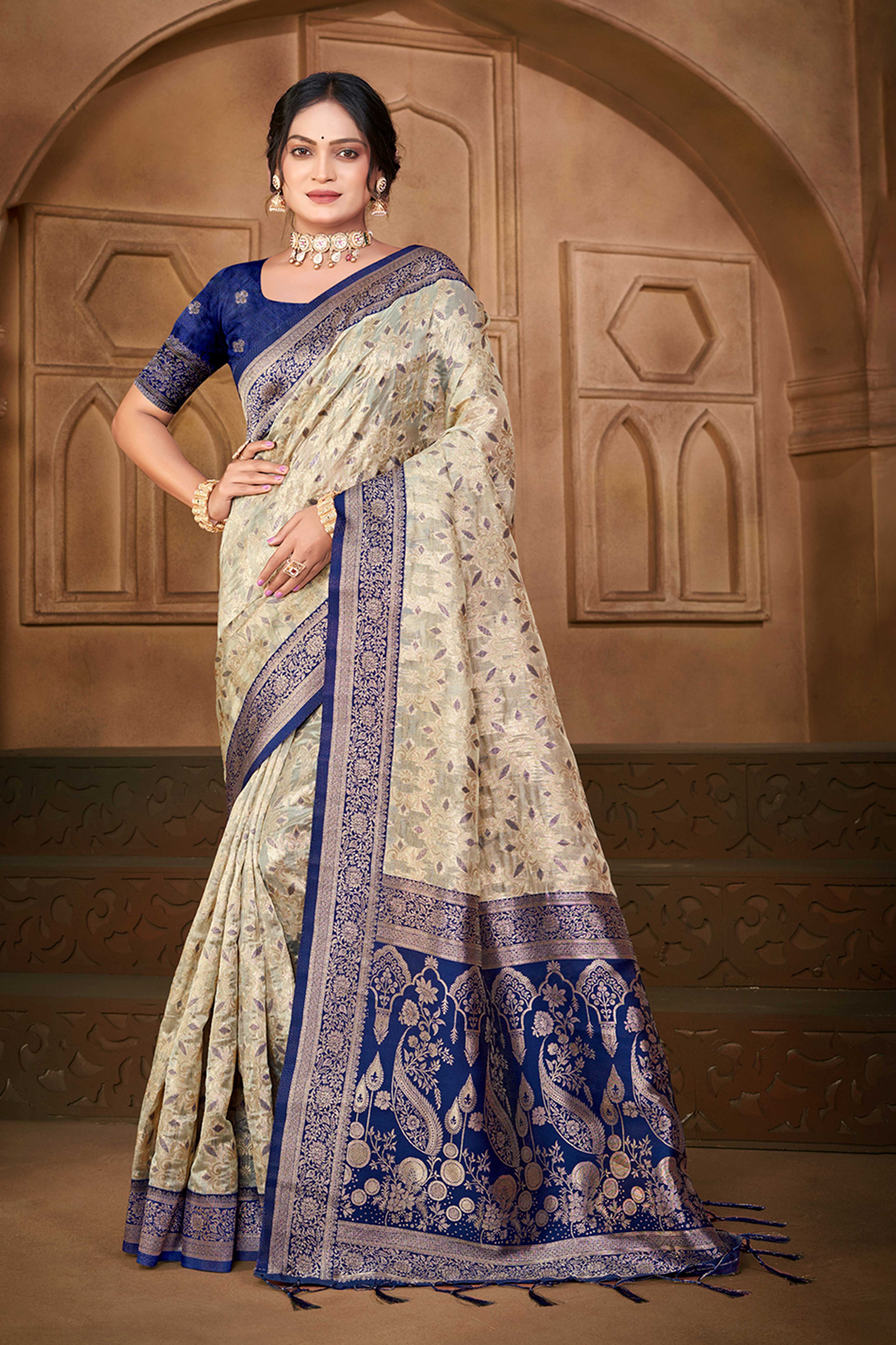 Stunning Beige & Navy Blue Floral Weaving Silk Blend Saree Enhanced With A Stylish Tassel Pallu