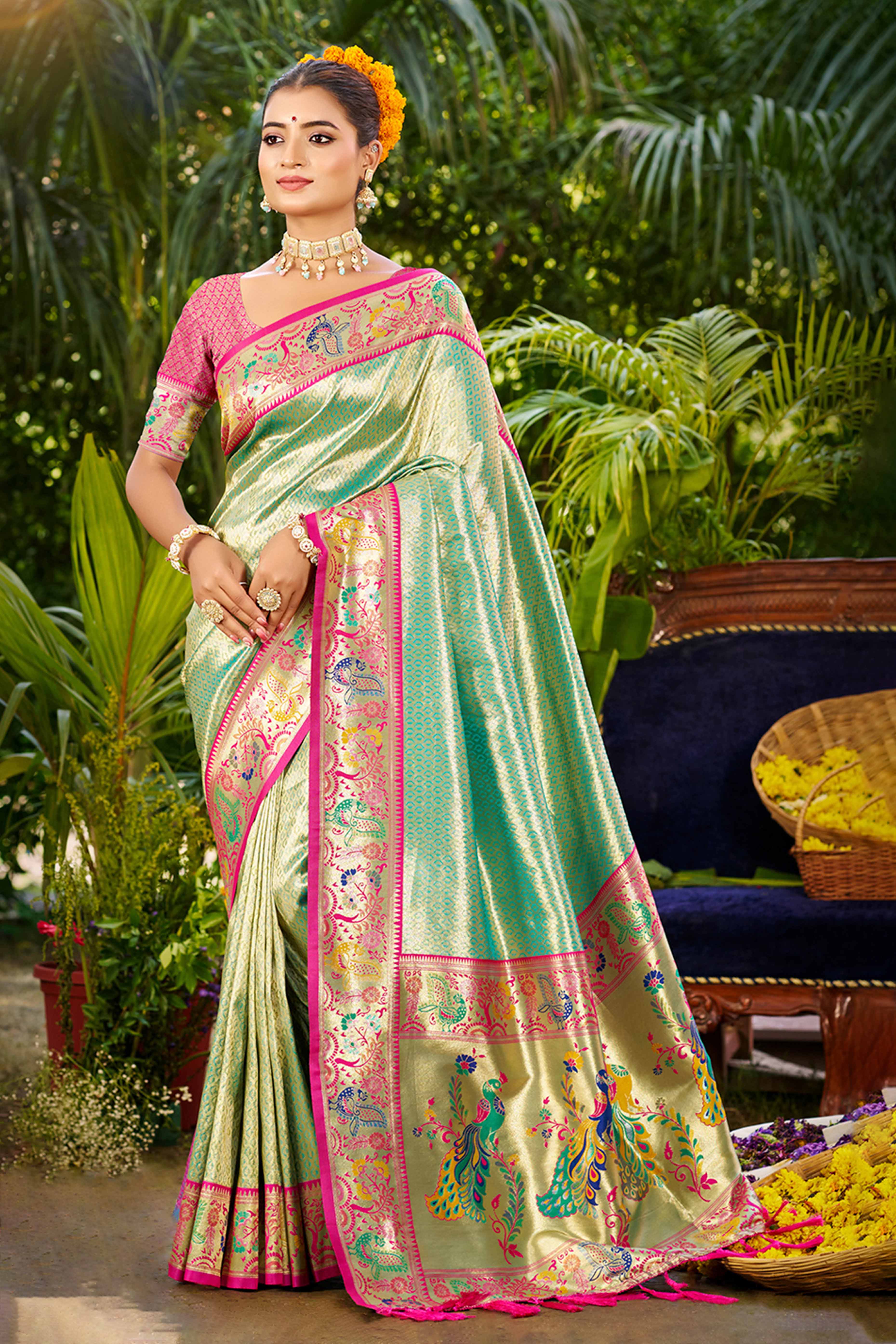Graceful Turquoise Silk Blend Saree Adorned With Intricate Zari Weave & Peacock Motif Pallu