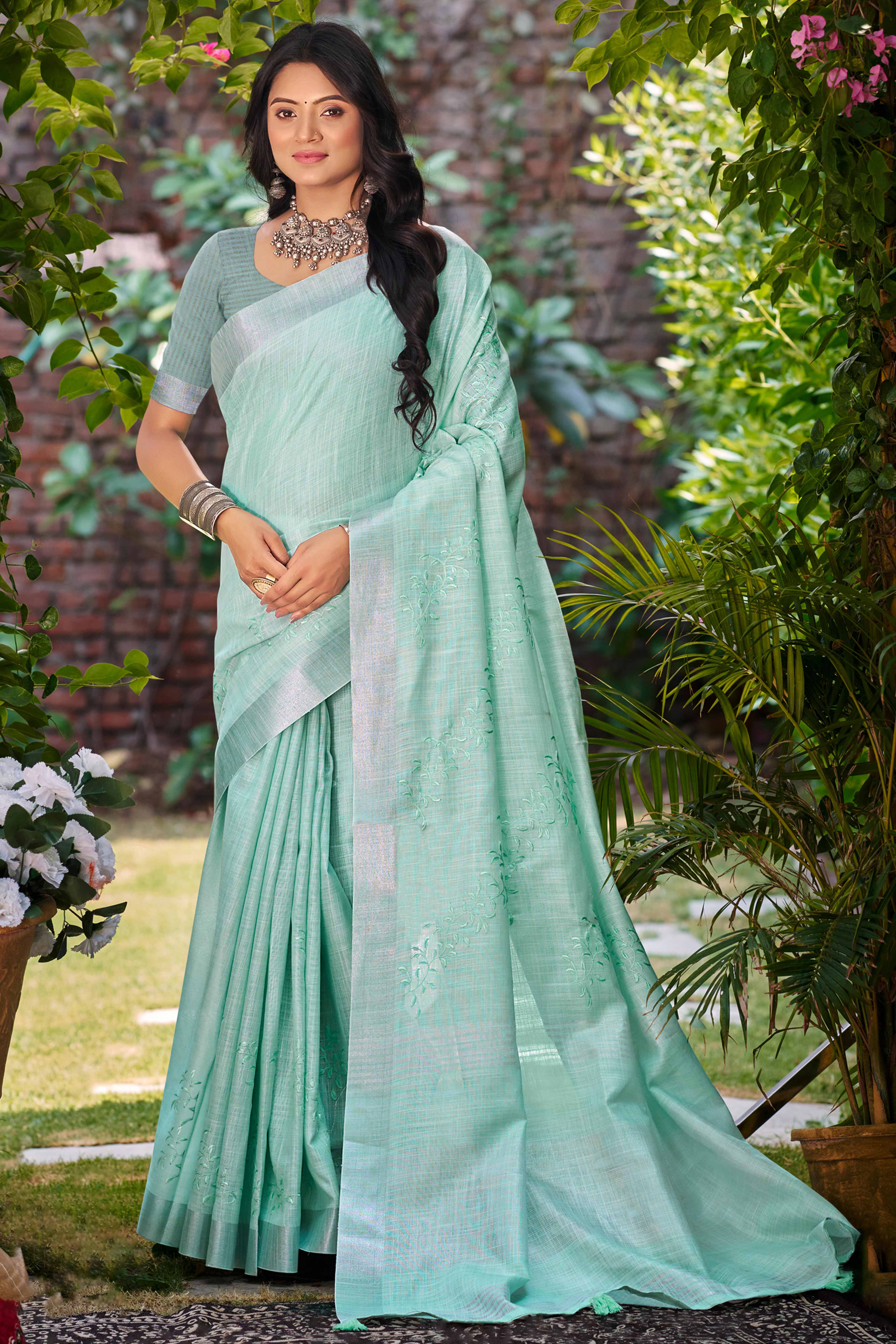 Elegant Sea Green Linen Saree Featuring Intricate Woven & Embroidered Patterns