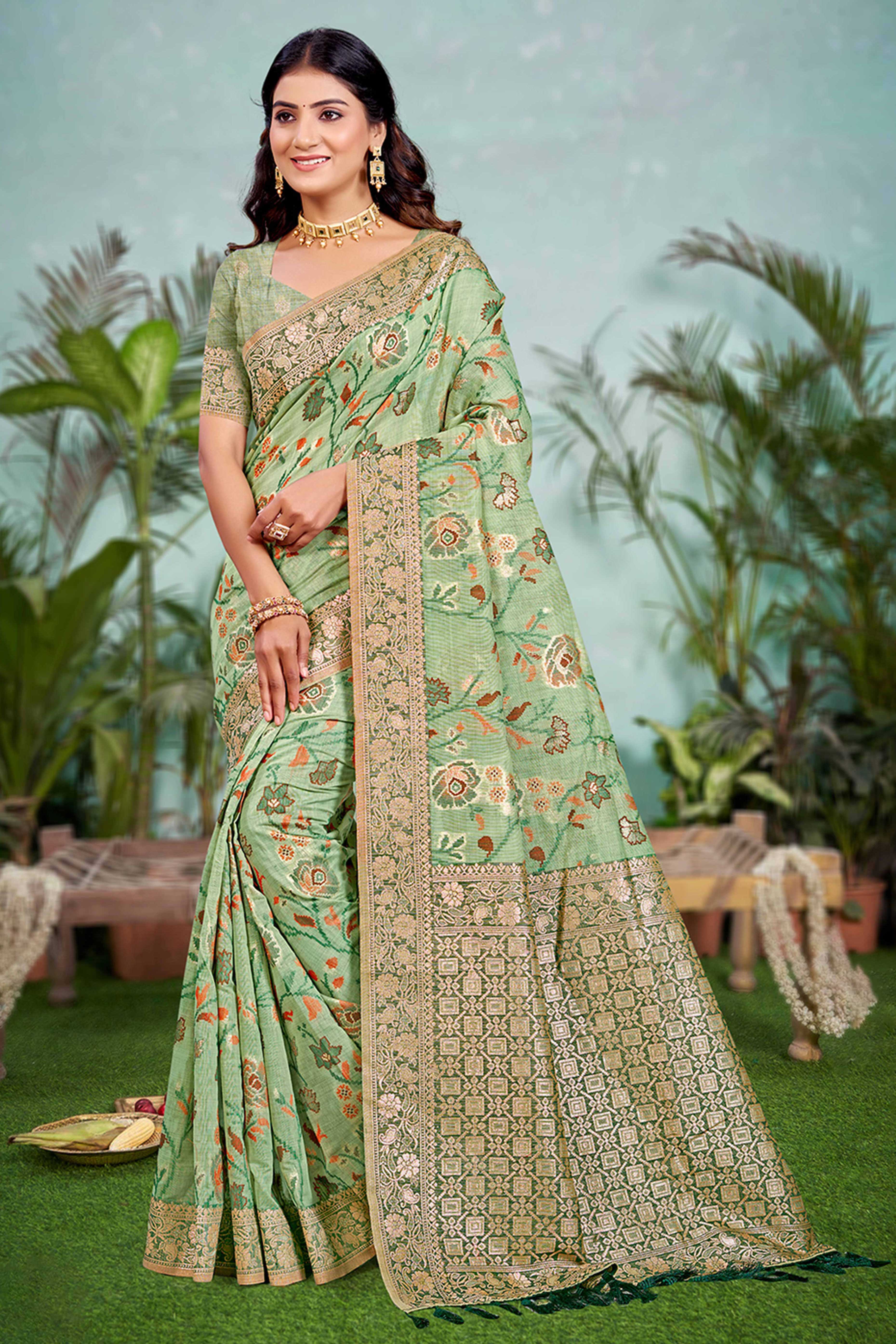 Captivating Green Floral Zari Weaving Cotton Silk Saree Accented With Tassel Pallu