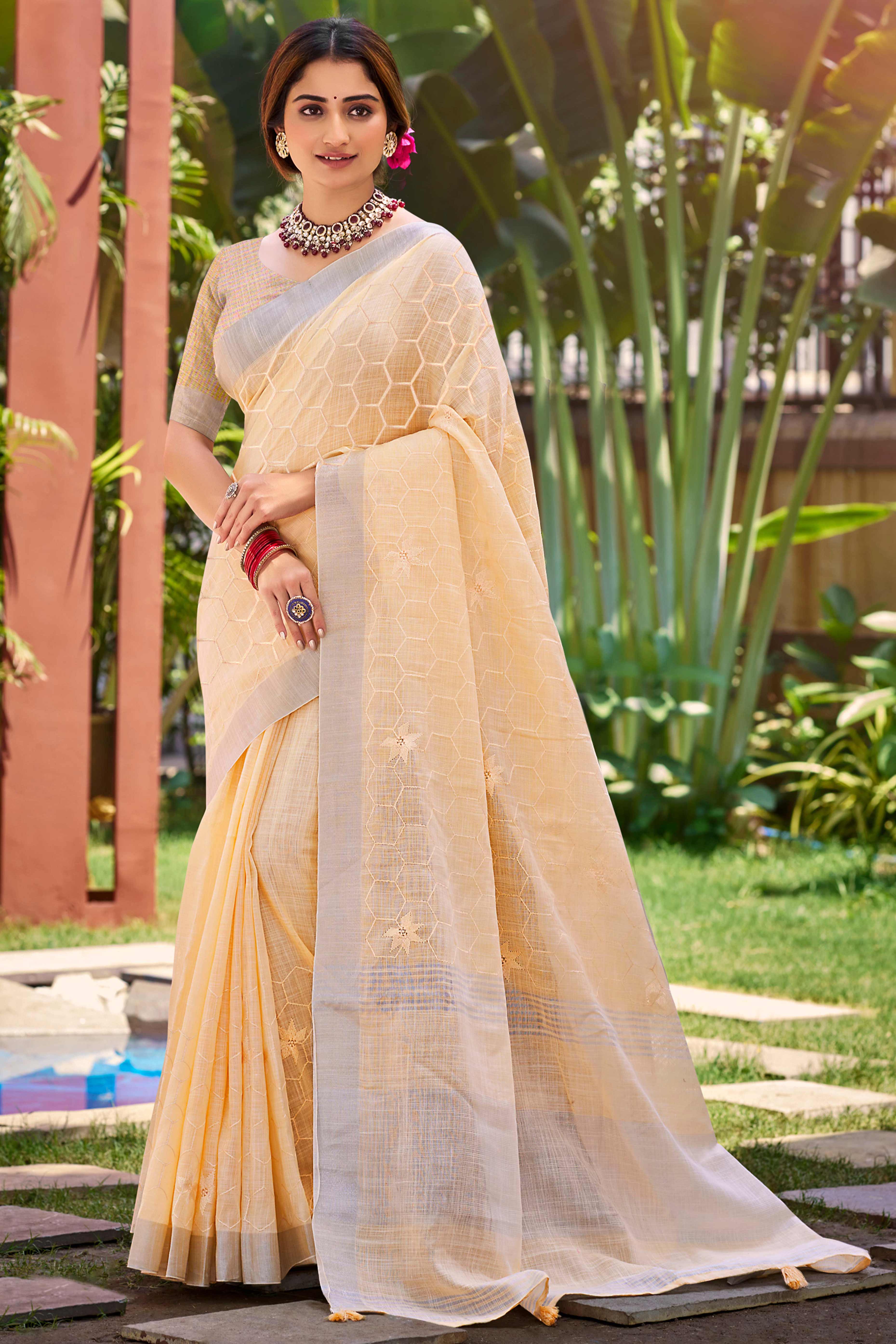 Light Peach Classic Linen Saree Enhanced With Fine Geometric Embroidery Work & Tassel Pallu