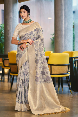 Grey Premium Cotton Silk Saree Highlighted With Floral Weaving Work & Tassel Pallu