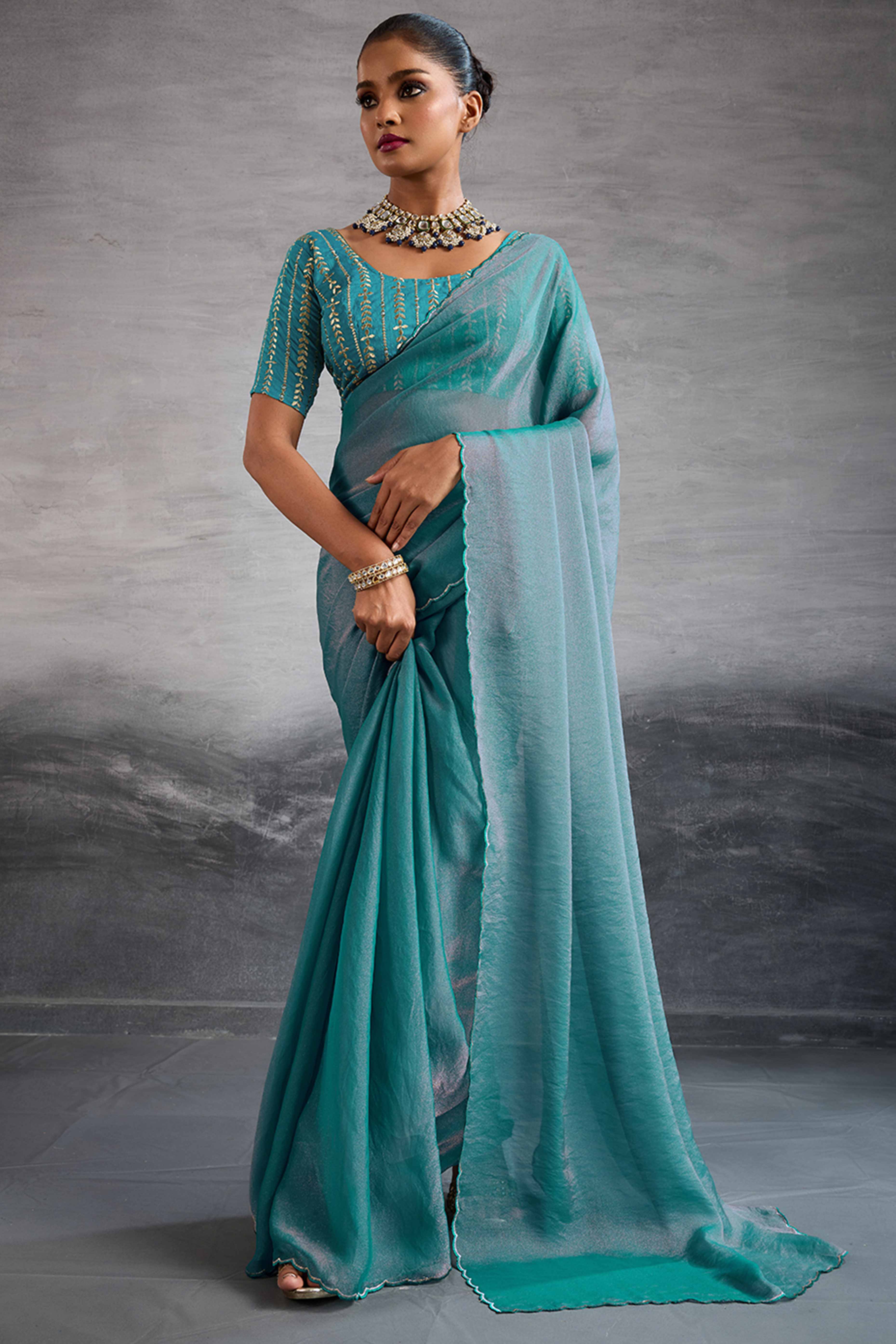 Turquoise Solid Organza Jimmy Choo Saree Accentuated With Elegant Cutwork Border Detailing