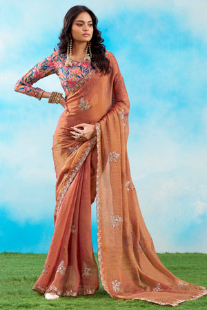 Luxurious Peach Chiffon Saree Showcasing Floral Sequins Embroidery In A Two Tone Finish