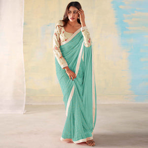Aqua Blue Foil Printed Georgette Saree With Embroidered Border