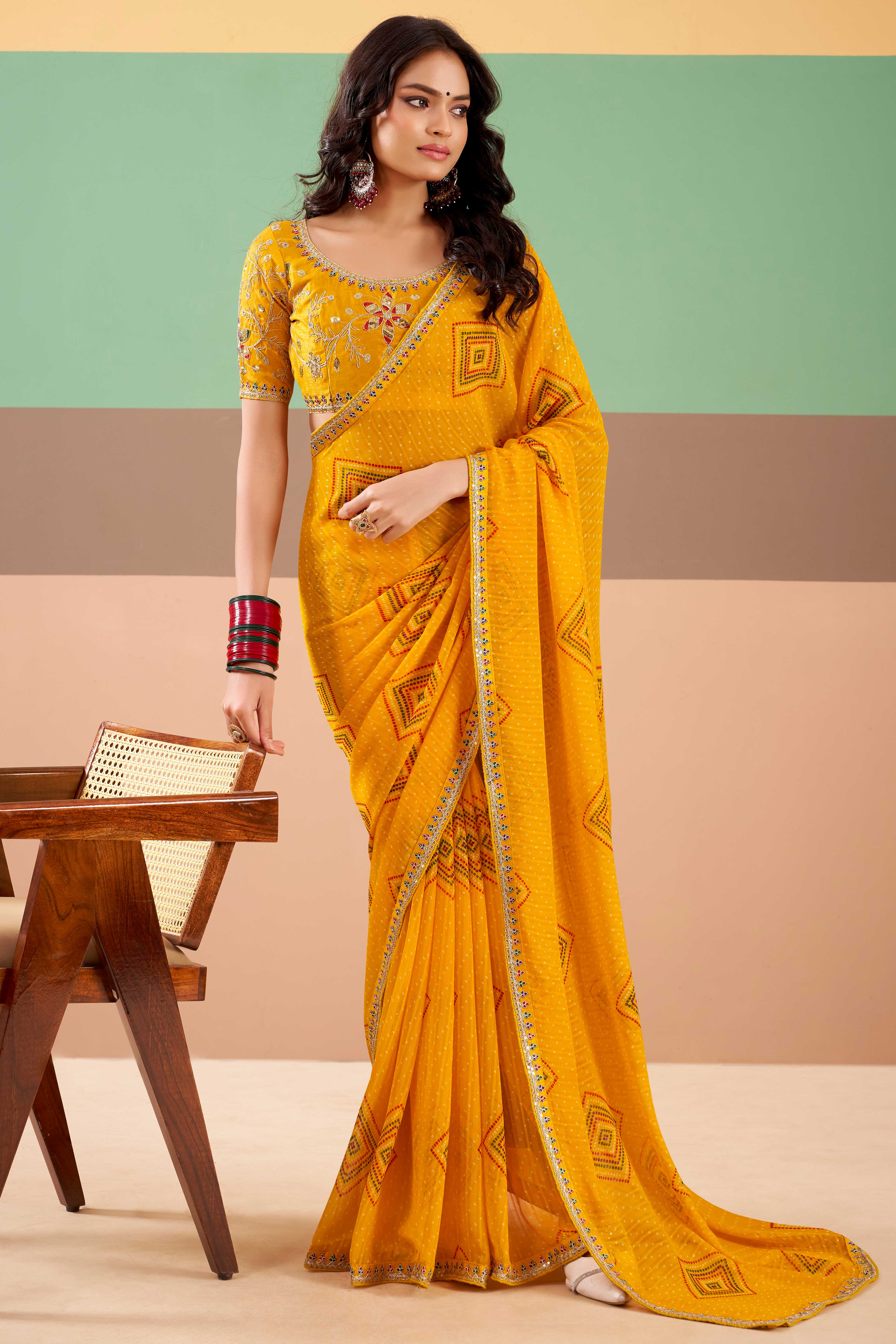 Charming Mustard Bandhani Printed Georgette Saree Adorned With Cording Embroidered Border