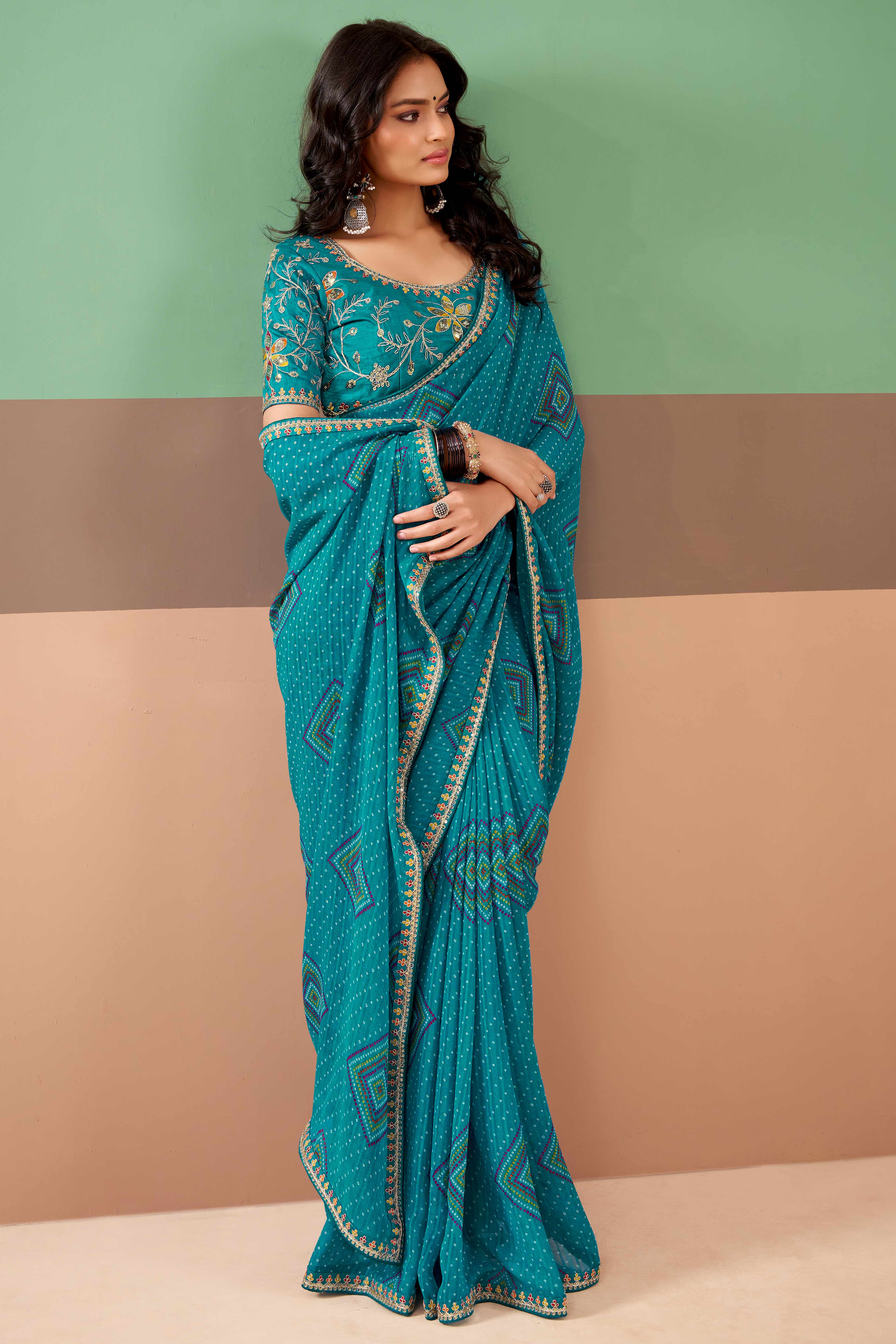 Charming Blue Bandhani Printed Georgette Saree Adorned With Intricate Cording Embroidered Border