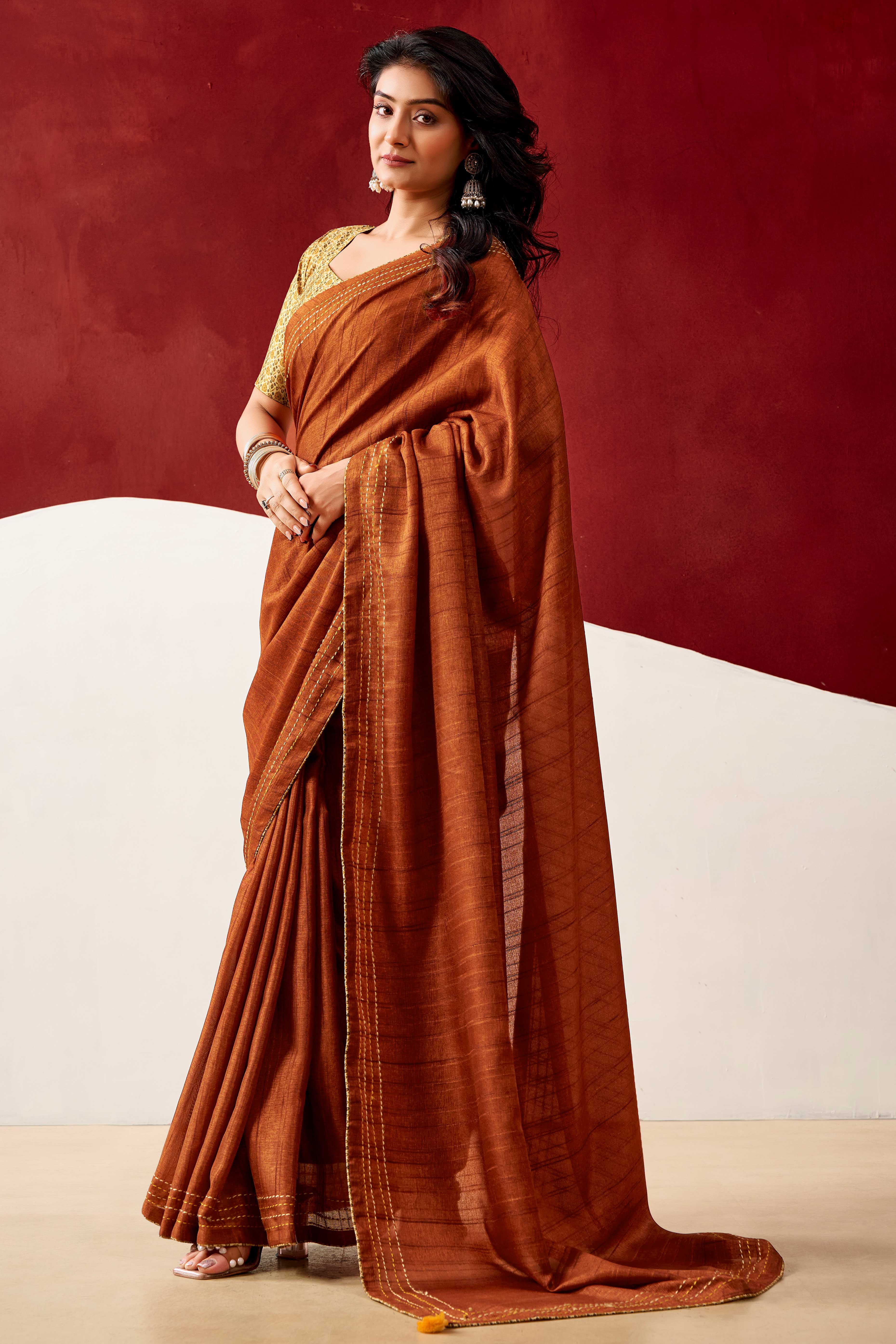 Graceful Rust Handloom Cotton Blend Saree Featuring Striped Lining Embroidery & Tassel Pallu