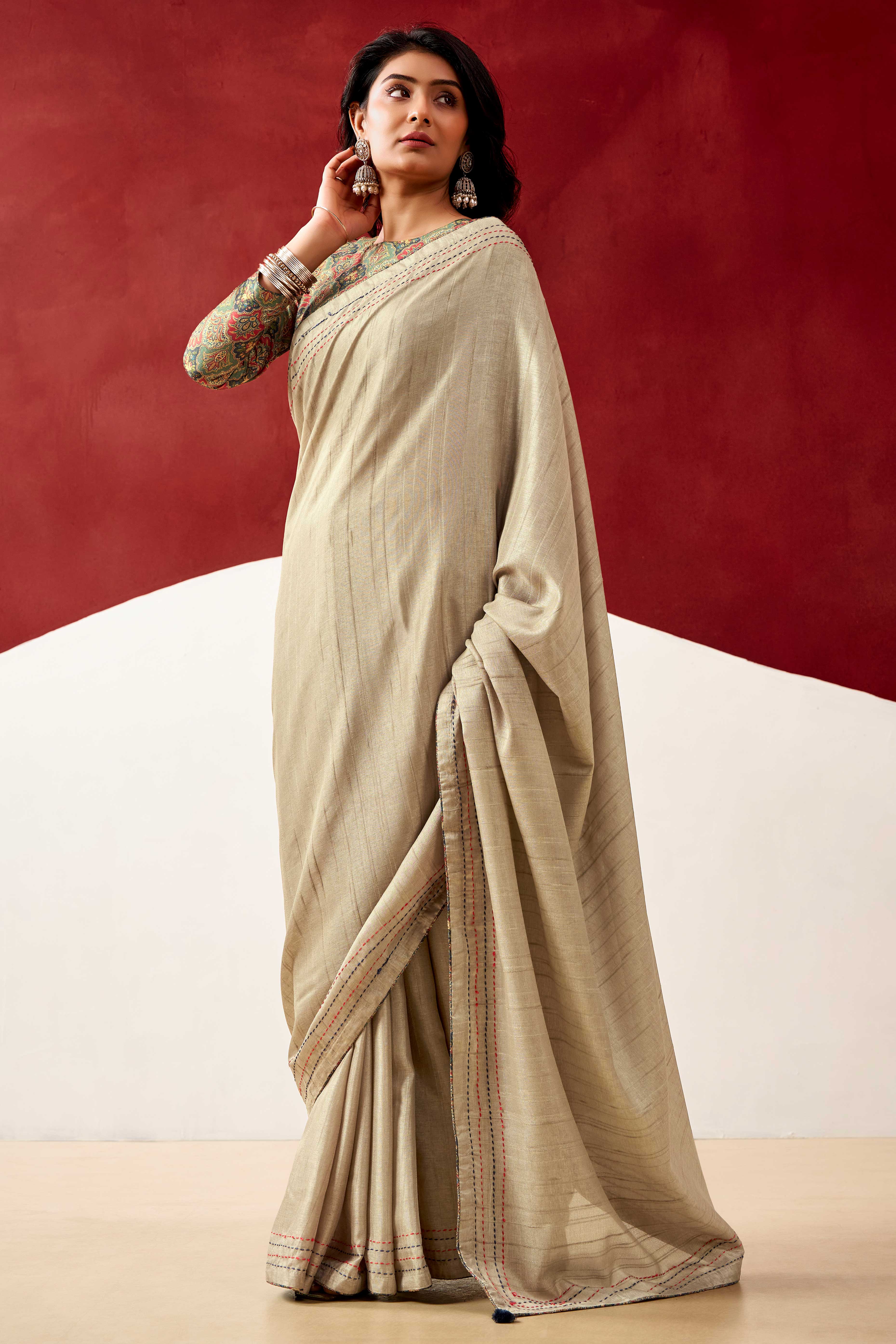 Graceful Cream Handloom Cotton Blend Saree Featuring Striped Lining Embroidery & Tassel Pallu