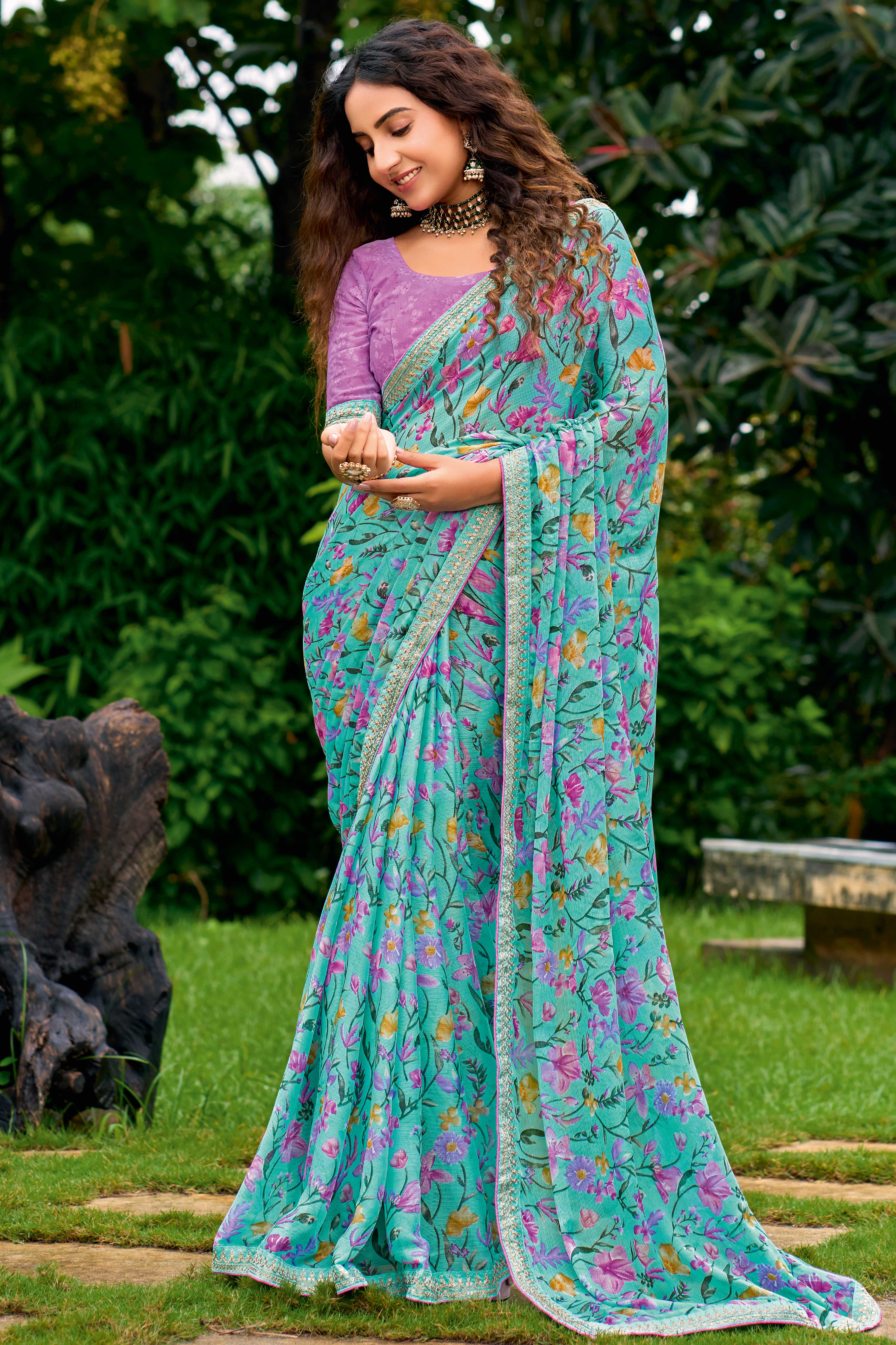 Turquoise Floral Chiffon Saree Enhanced with Fine Embroidery on the Border
