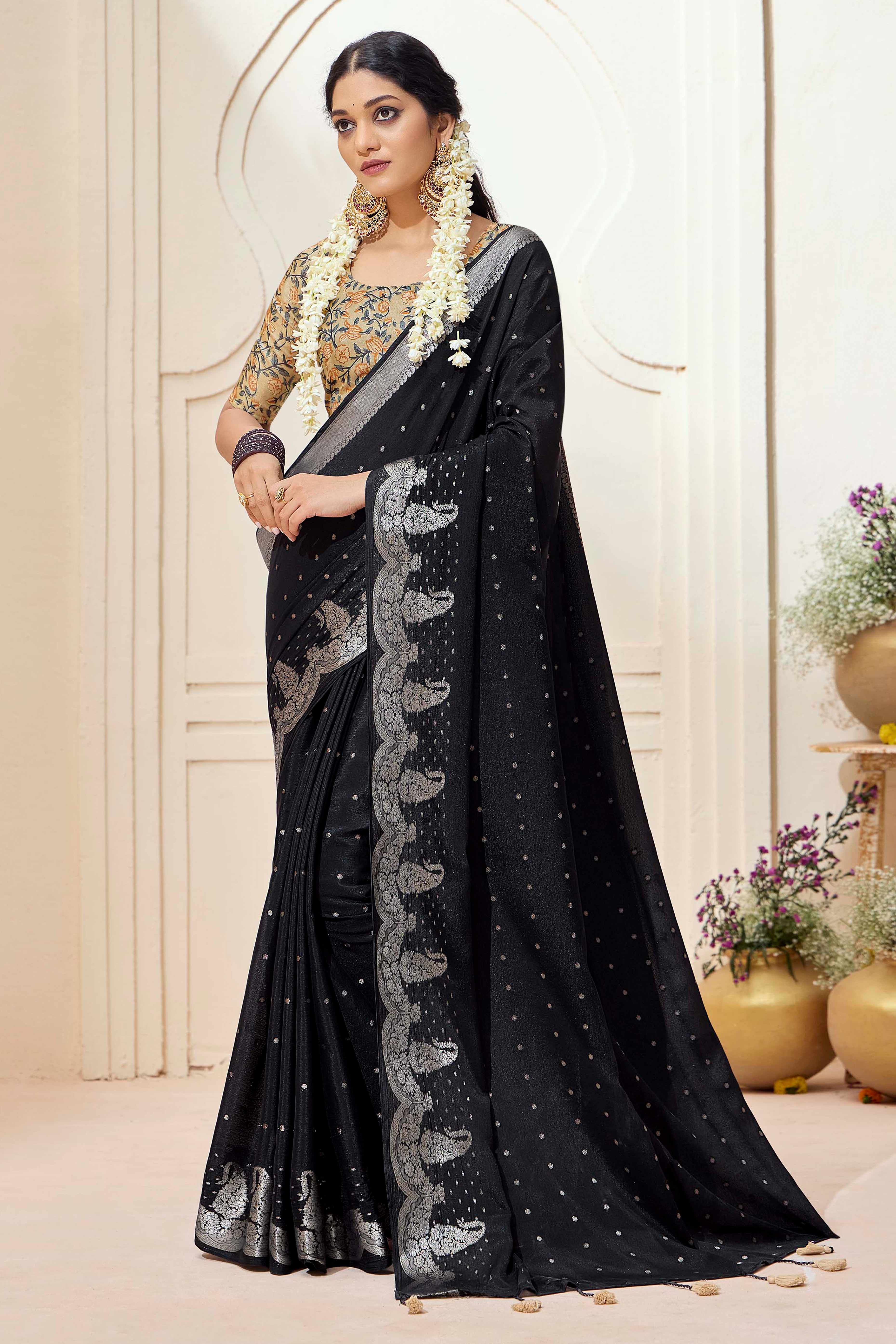 Black Chinon Saree with Jacquard Weaving and Delicate Tassel Accents