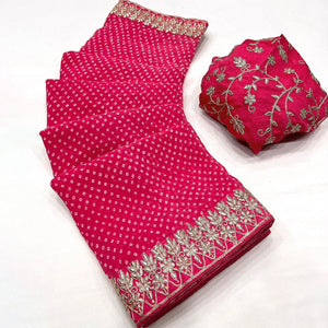 Pink Lightweight Georgette Saree Adorned with Classic Bandhani Prints and Lace Work