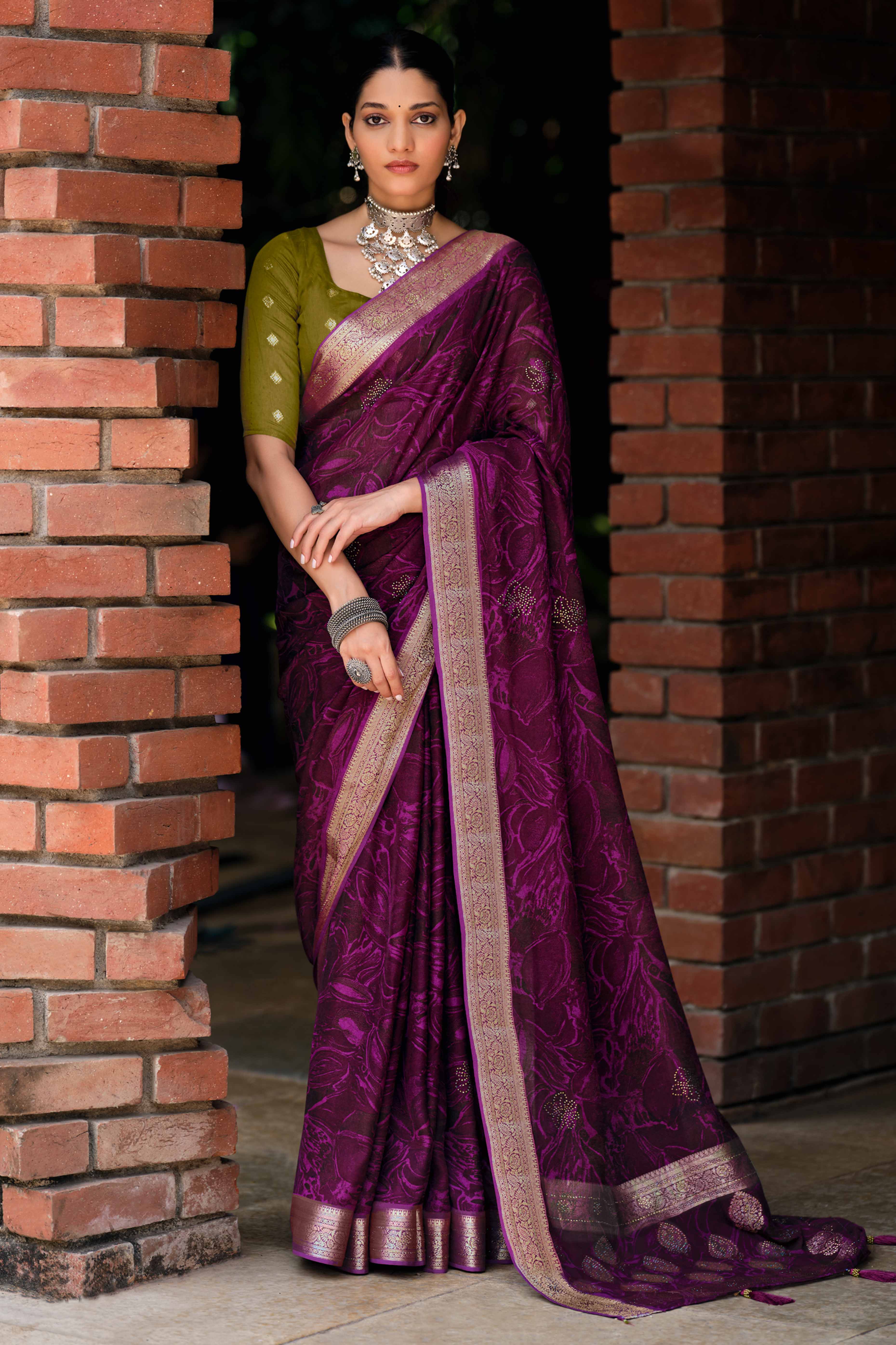 Magenta Abstract Printed Georgette Saree Enhanced with Subtle and Shiny Stone Work