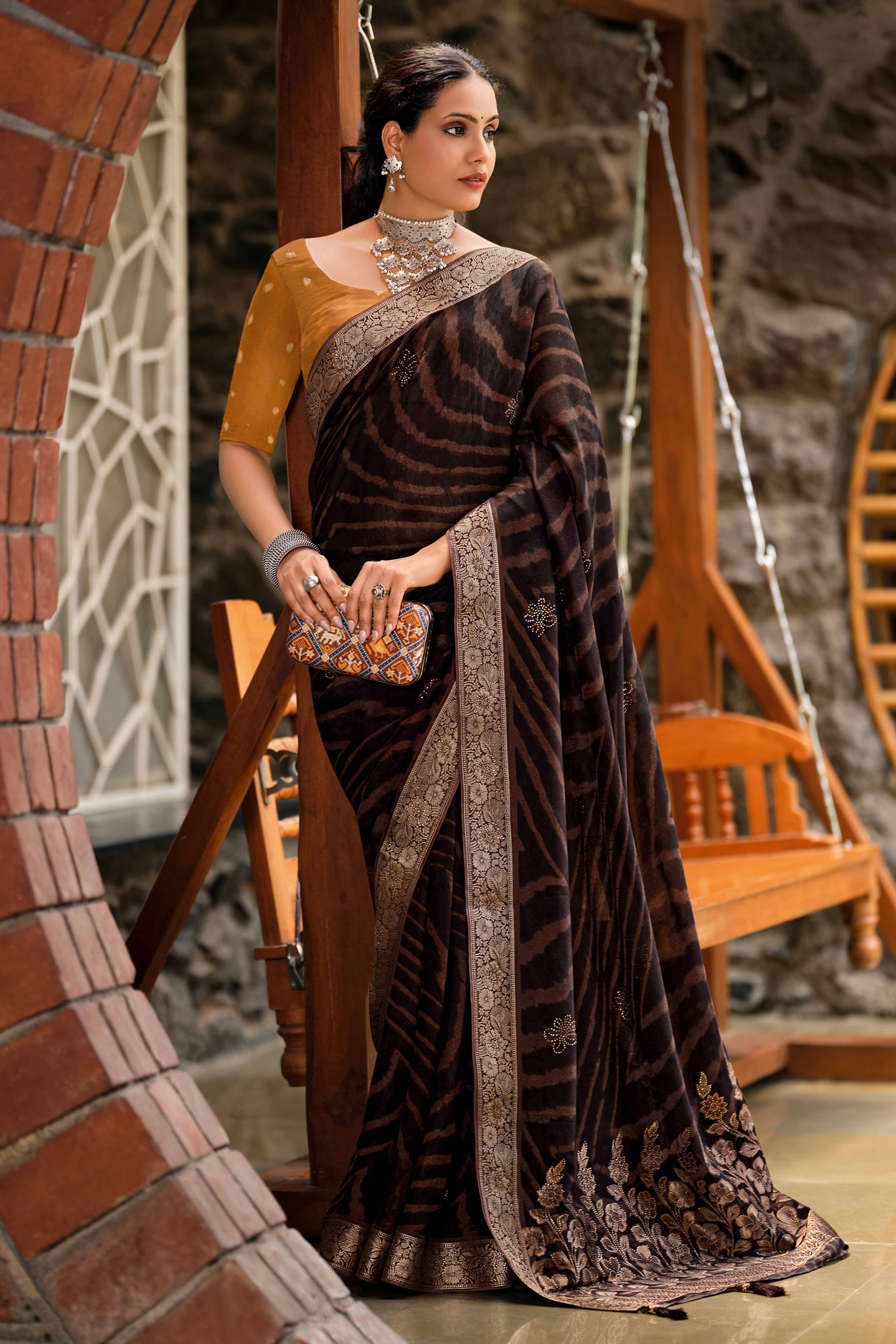 Coffee Brown Abstract Printed Georgette Saree Enhanced with Subtle and Shiny Stone Work