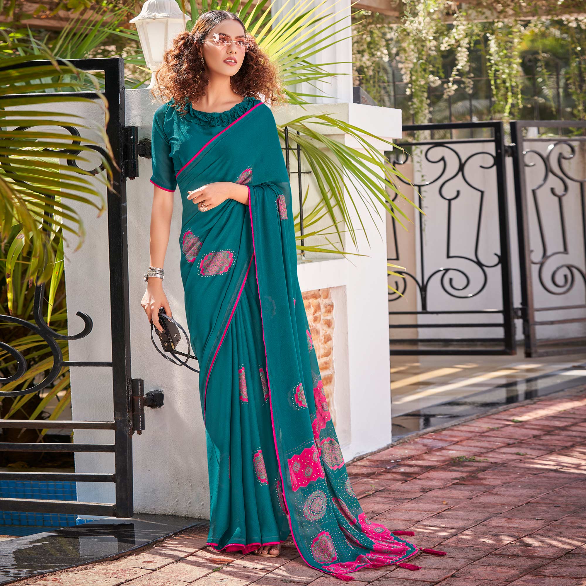 Teal Foil Printed Georgette Saree With Tassels