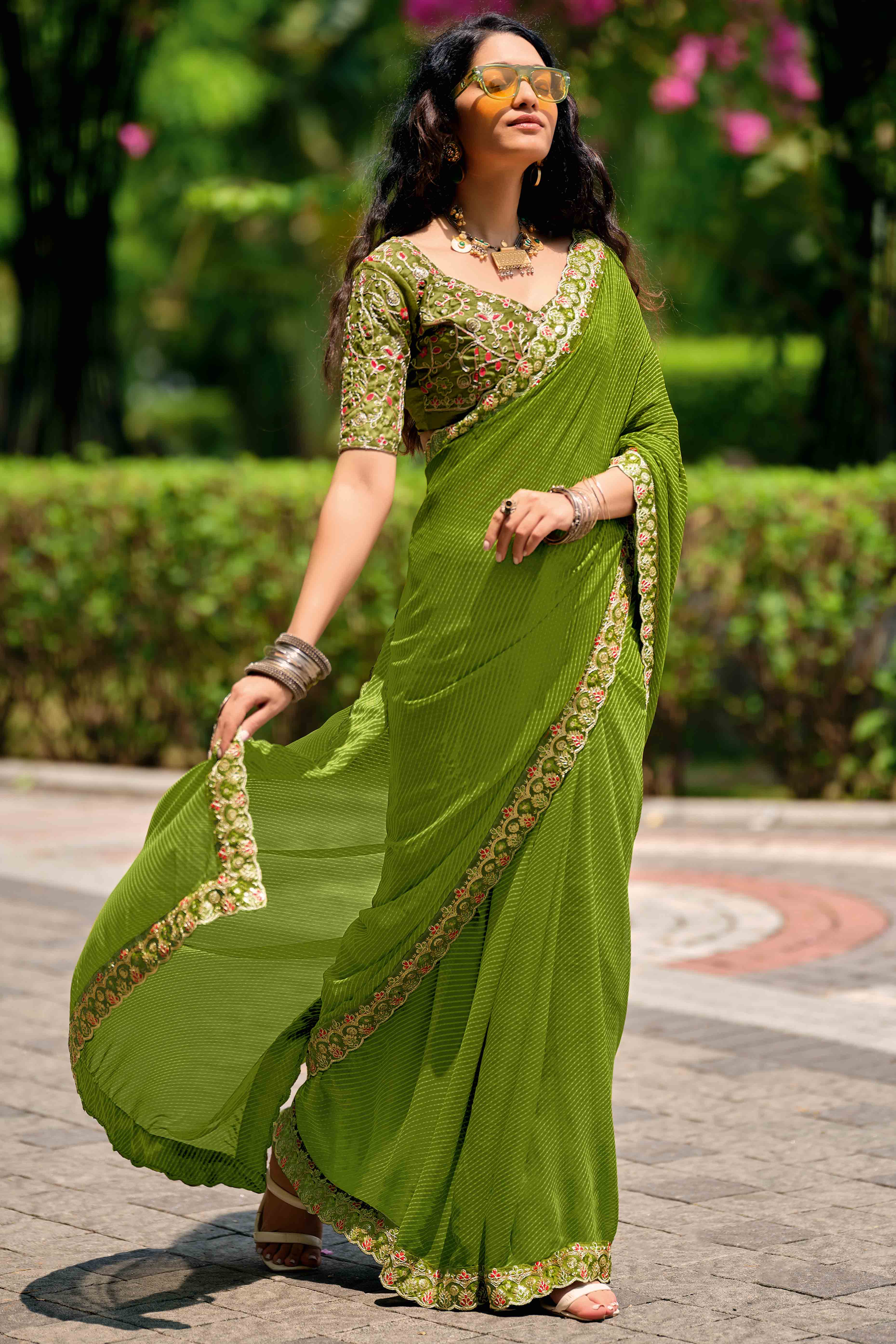 Green Striped Printed Georgette Saree With Shimmering Sequin Embroidered Border