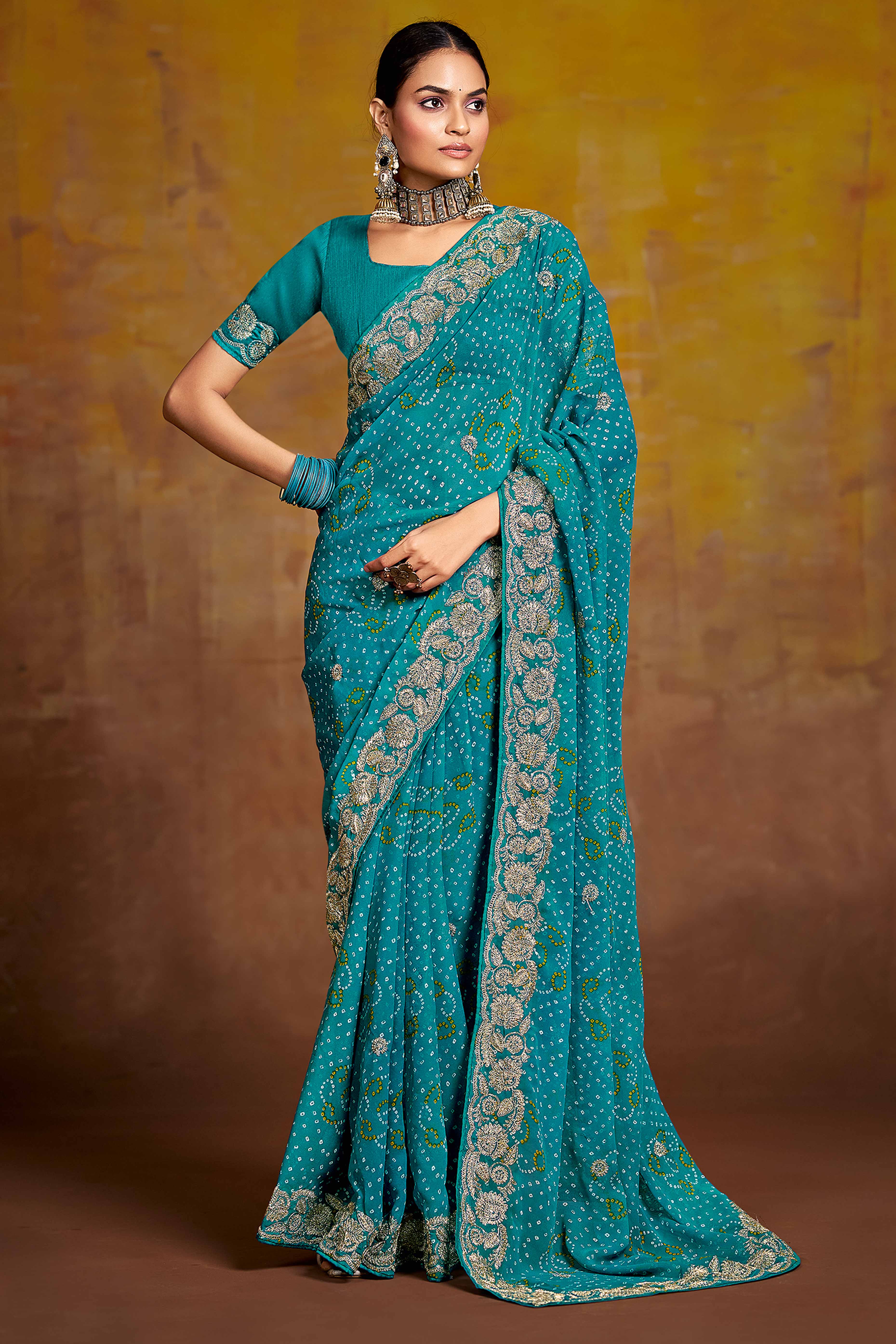 Blue Georgette Saree Adorned With Traditional Bandhani Prints & Intricate Floral Embroidery