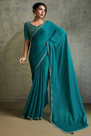 Teal Solid Chiffon Saree With Sparkling Zarkan Border & Latkan Pallu