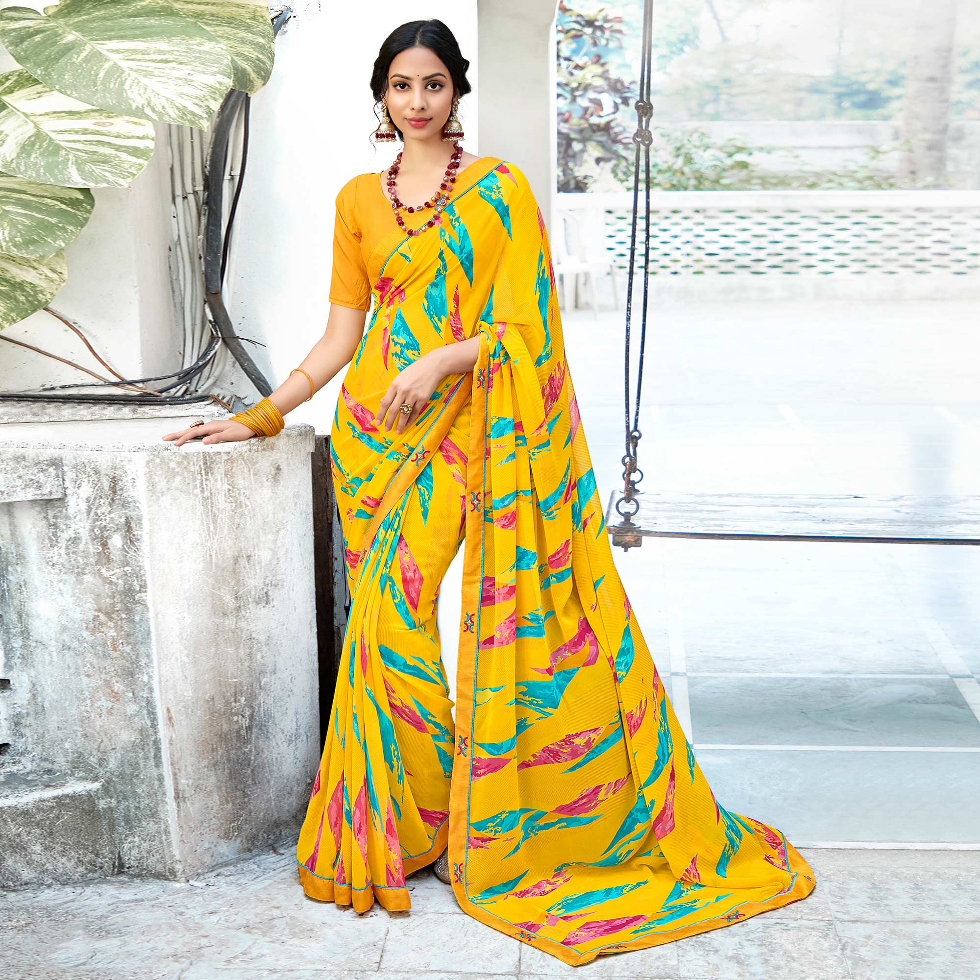 Yellow Geometric Printed Georgette Saree With Lace Border
