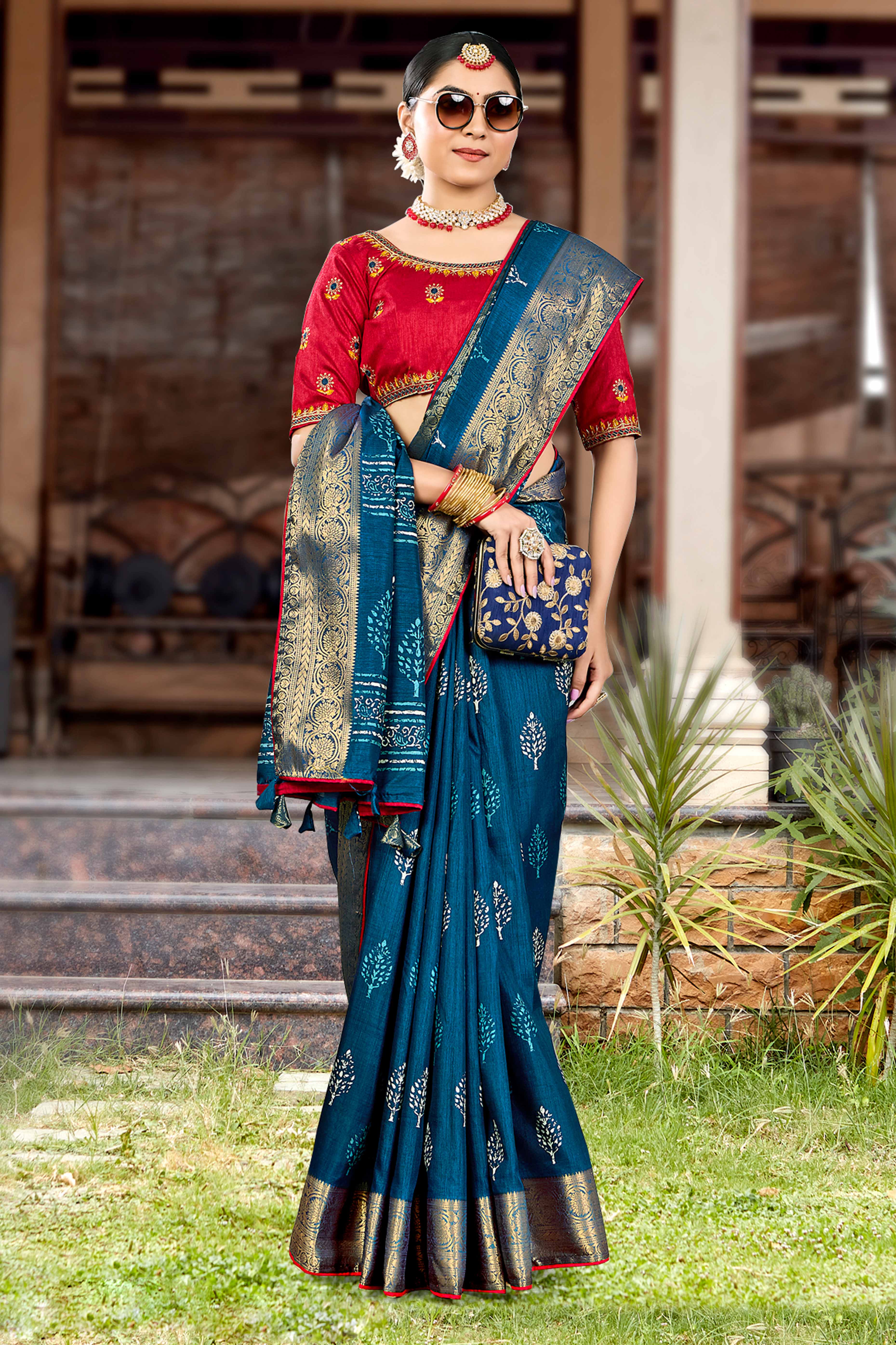 Blue Dola Silk Saree Featuring Artistic Print Work & Graceful Tassel Edging