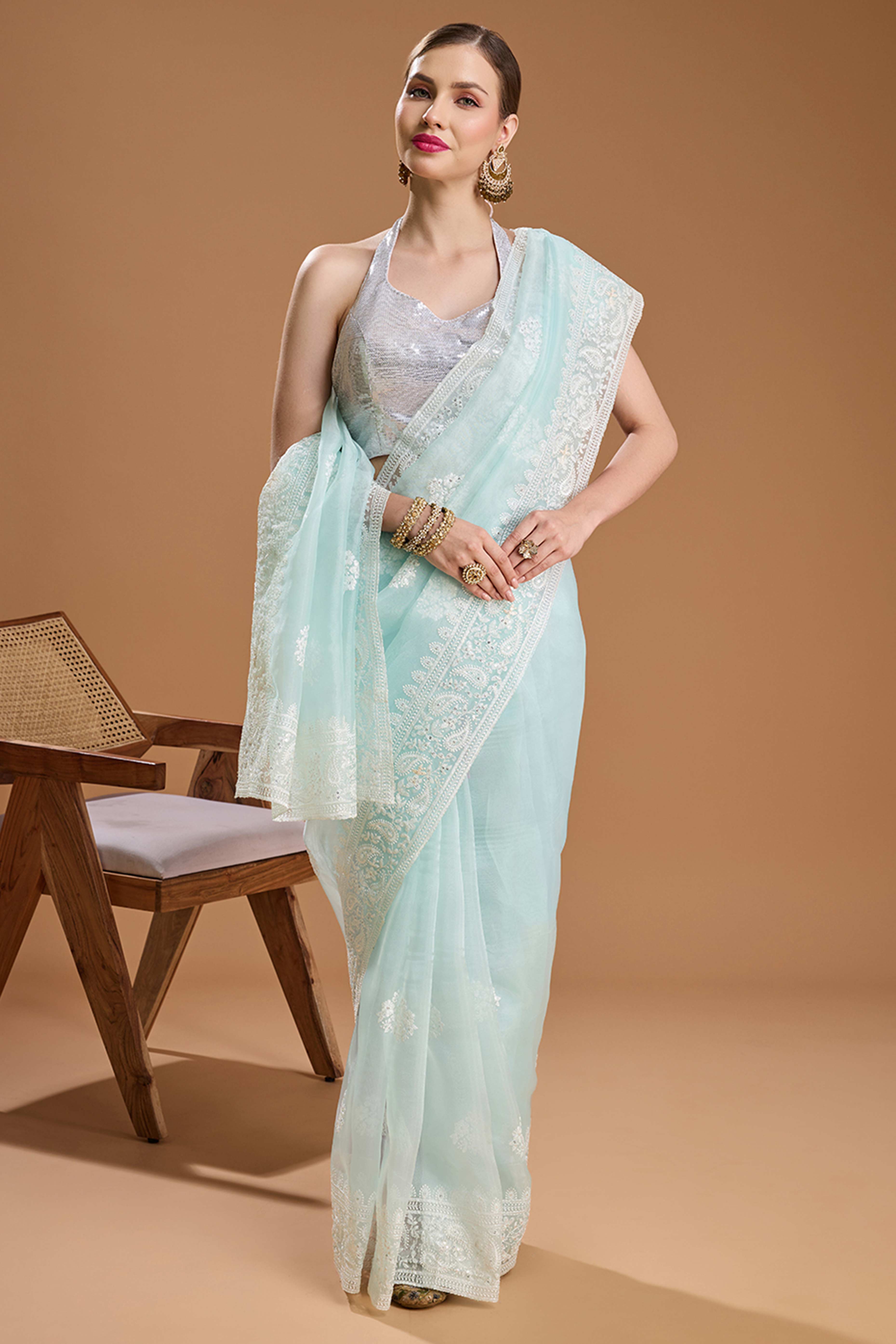 Mint Green Net Saree Enhanced with Elegant Sequins Embellishments