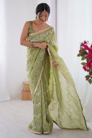 Dazzling Pista Green Organza Saree Accented with Sequin, Bead & Stone Work and Delicate Lace Detailing