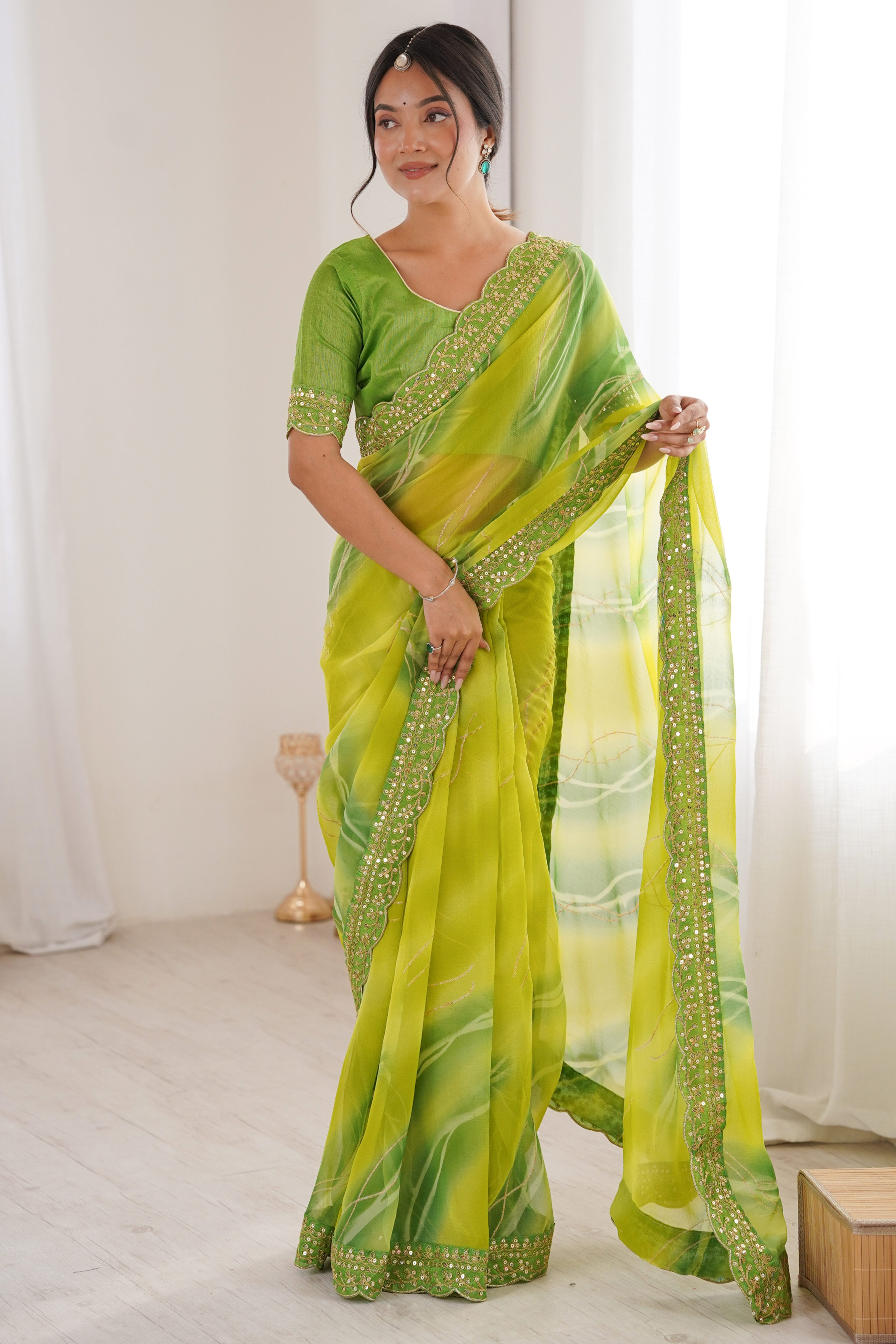 Graceful Green Foil Print Georgette Saree Featuring A Luxurious Cording Sequins Embroidered Border