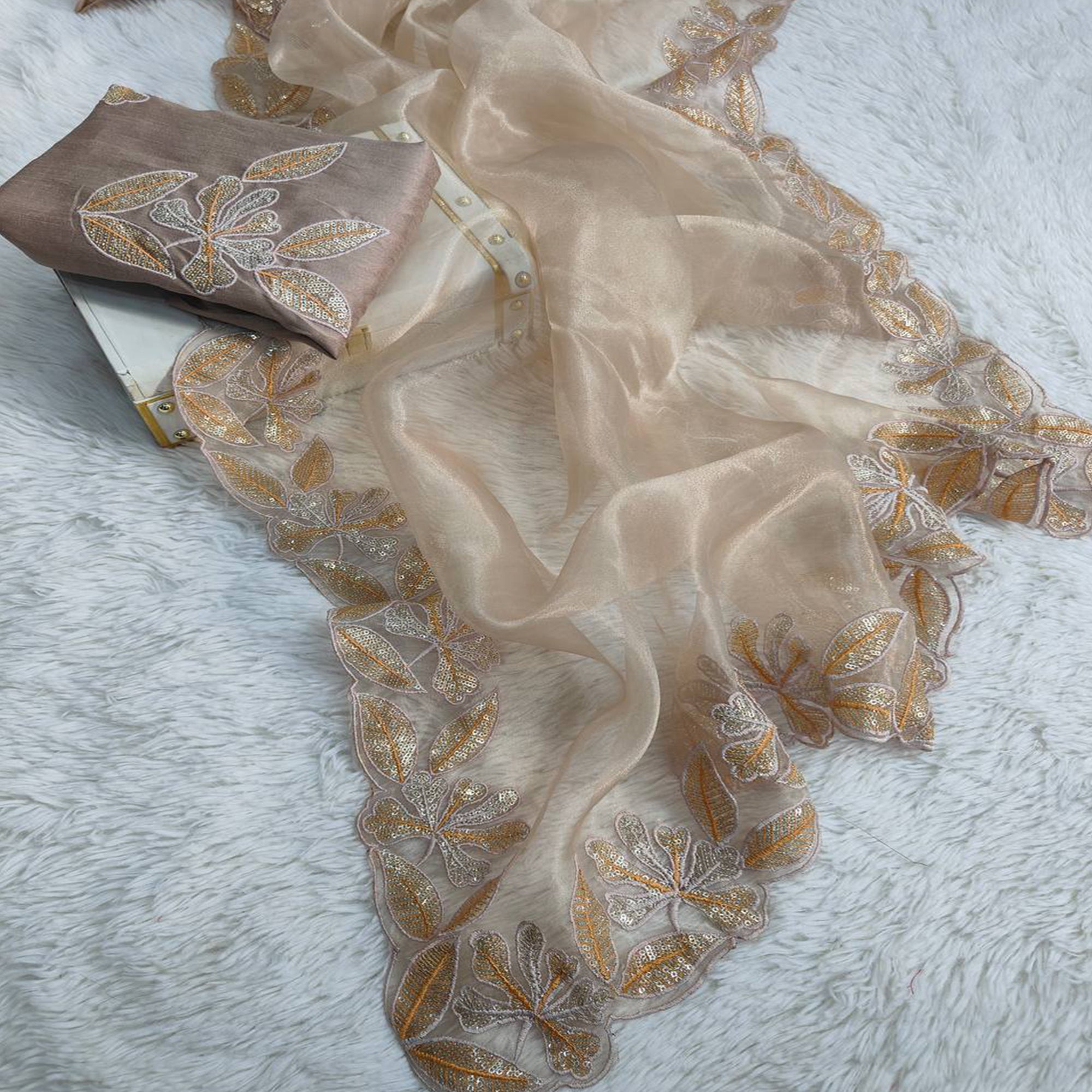 Sophisticated Beige Organza Silk Saree Beautified With Intricate Floral Embroidery & Sequins Work
