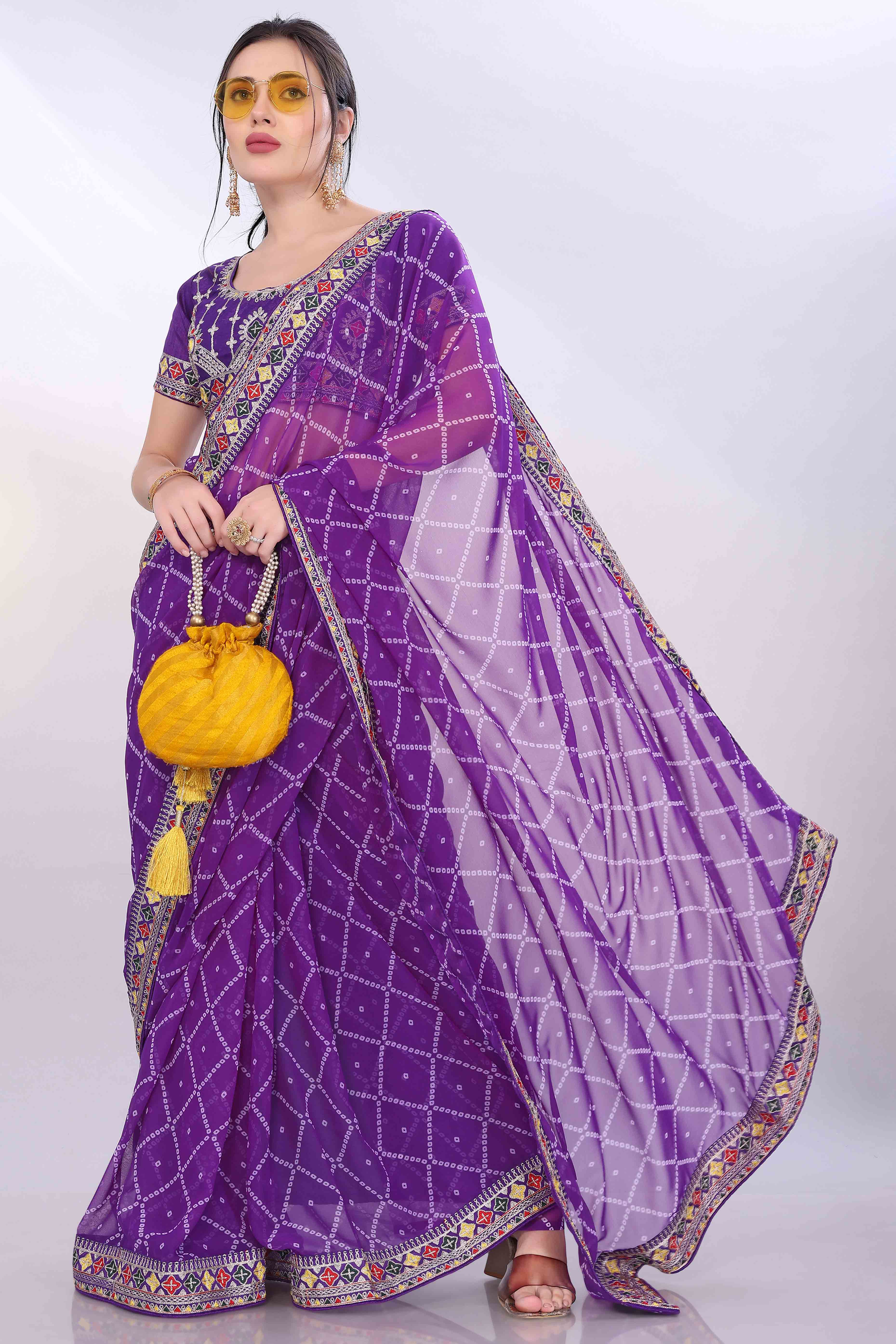 Purple Bandhani Printed Georgette Saree Framed With Elegant Embroidered Border