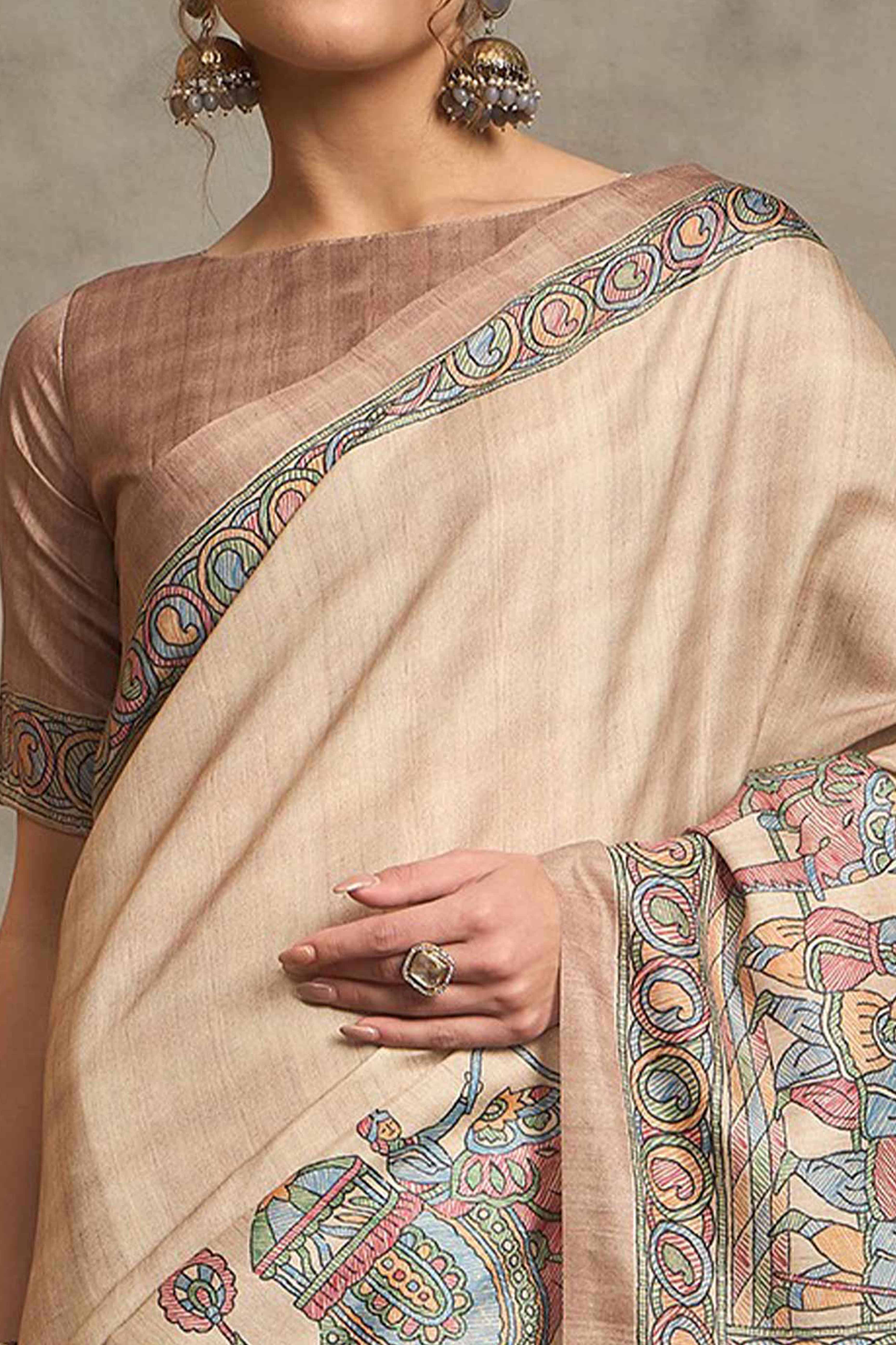 Cream Colored Art Silk Saree Featuring Artistic Madhubani Motifs