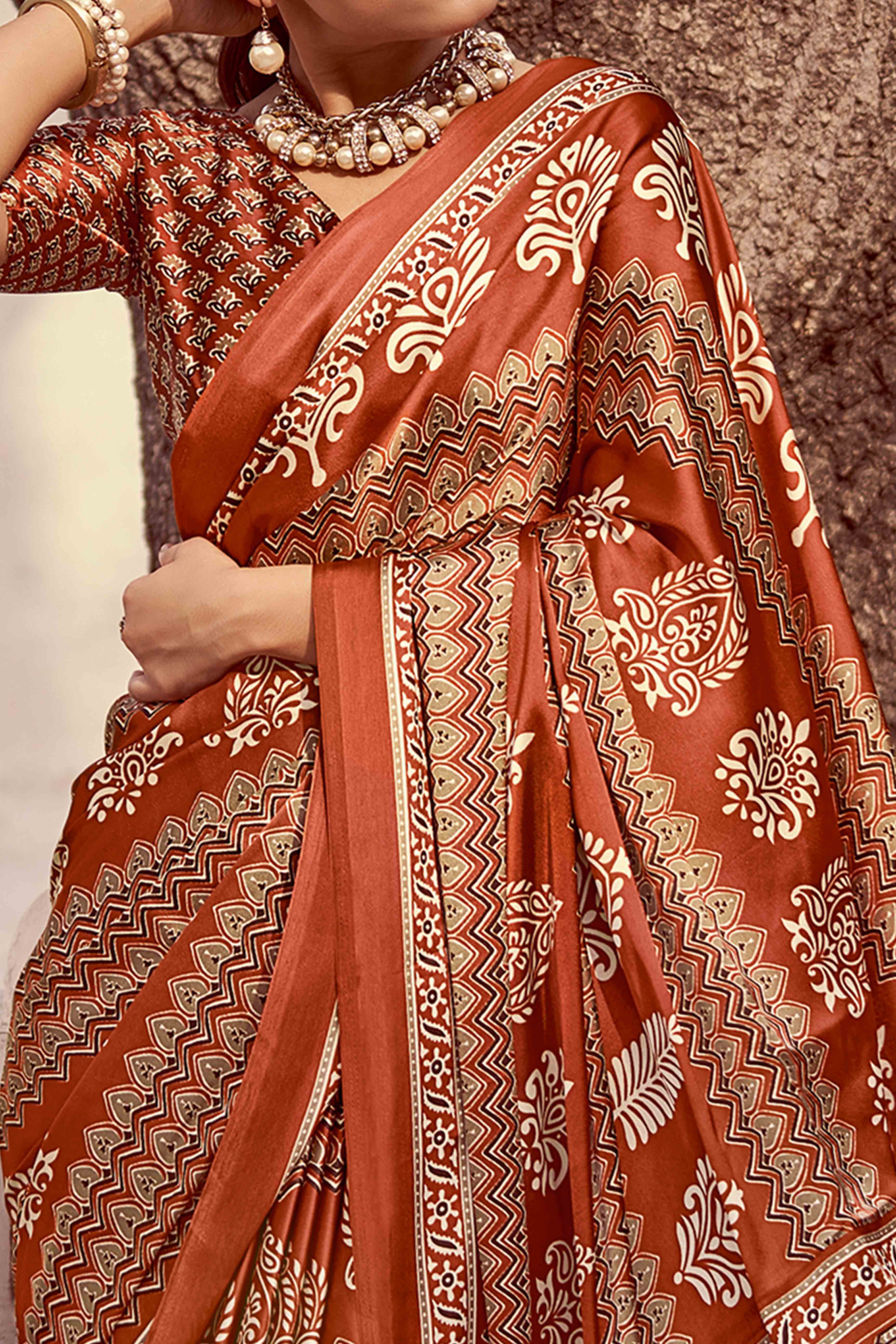 Rust Floral Ajrakh Printed Satin Saree With Tassels