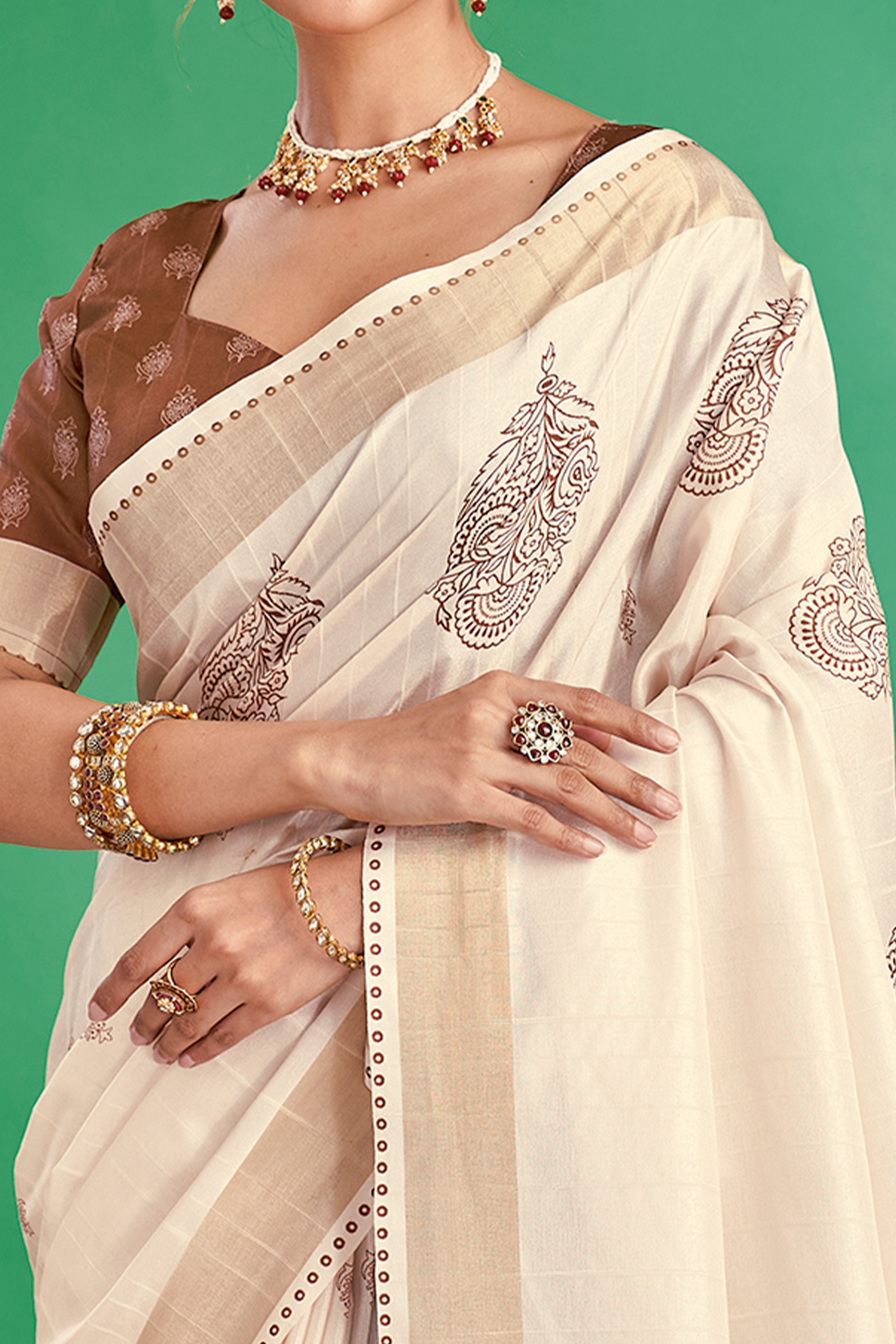 Charming Offwhite & Brown Floral Printed Kotha Cotton Silk Saree Adorned With Graceful Tassel Pallu